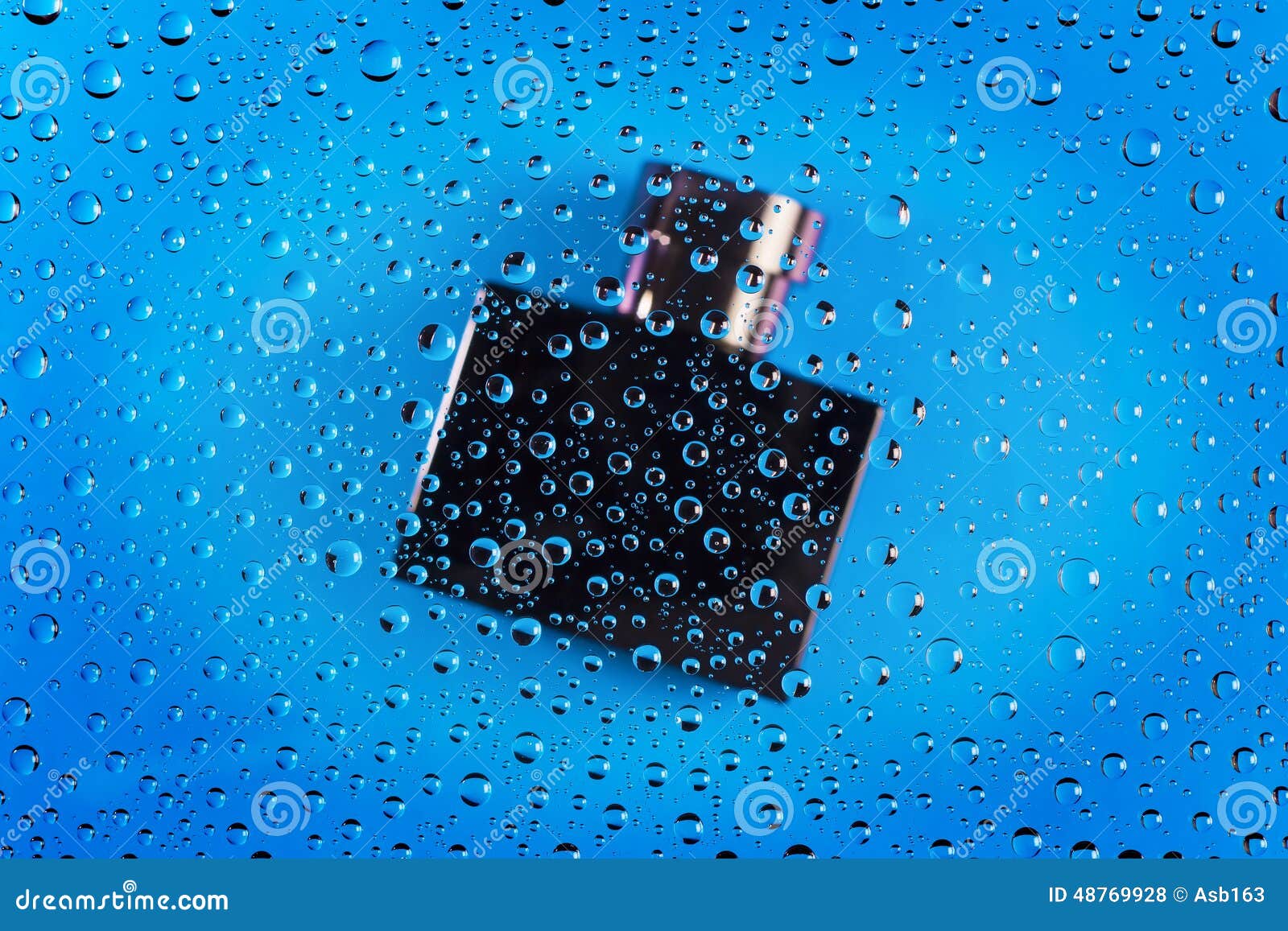Bottle of Cologne through Water Drops on Glass Stock Photo Image of
