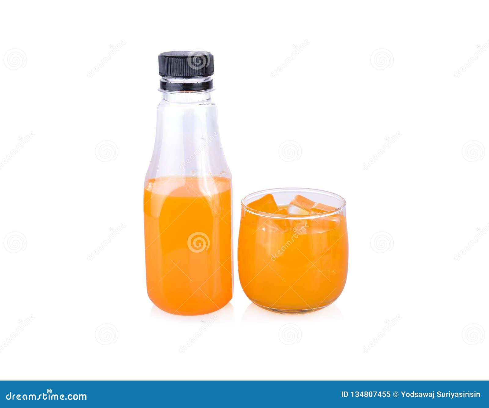 Bottle and Glass of Orange Juice on White Background Stock Image