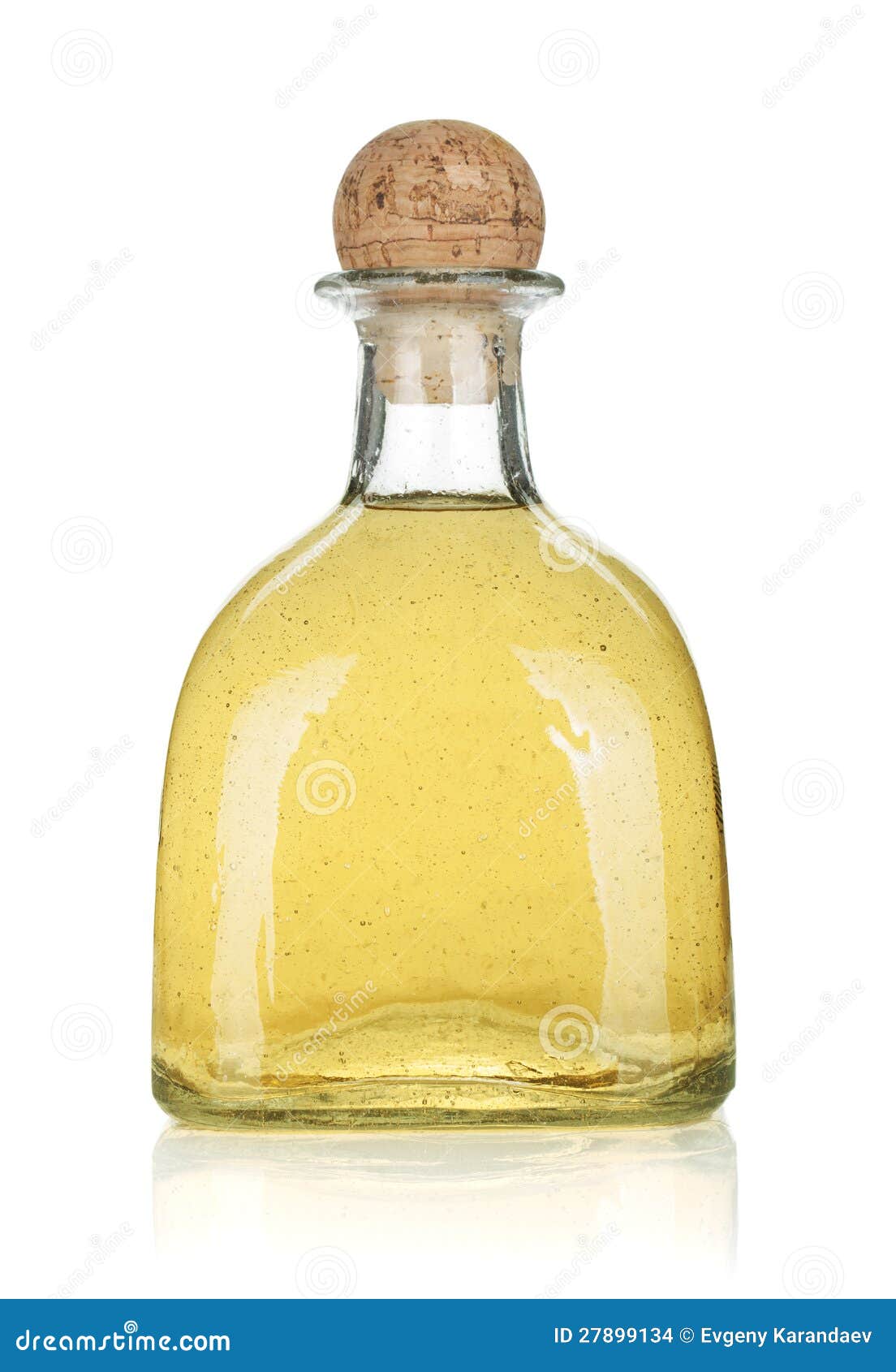 Bottle of gold tequila stock photo. Image of reflection 27899134
