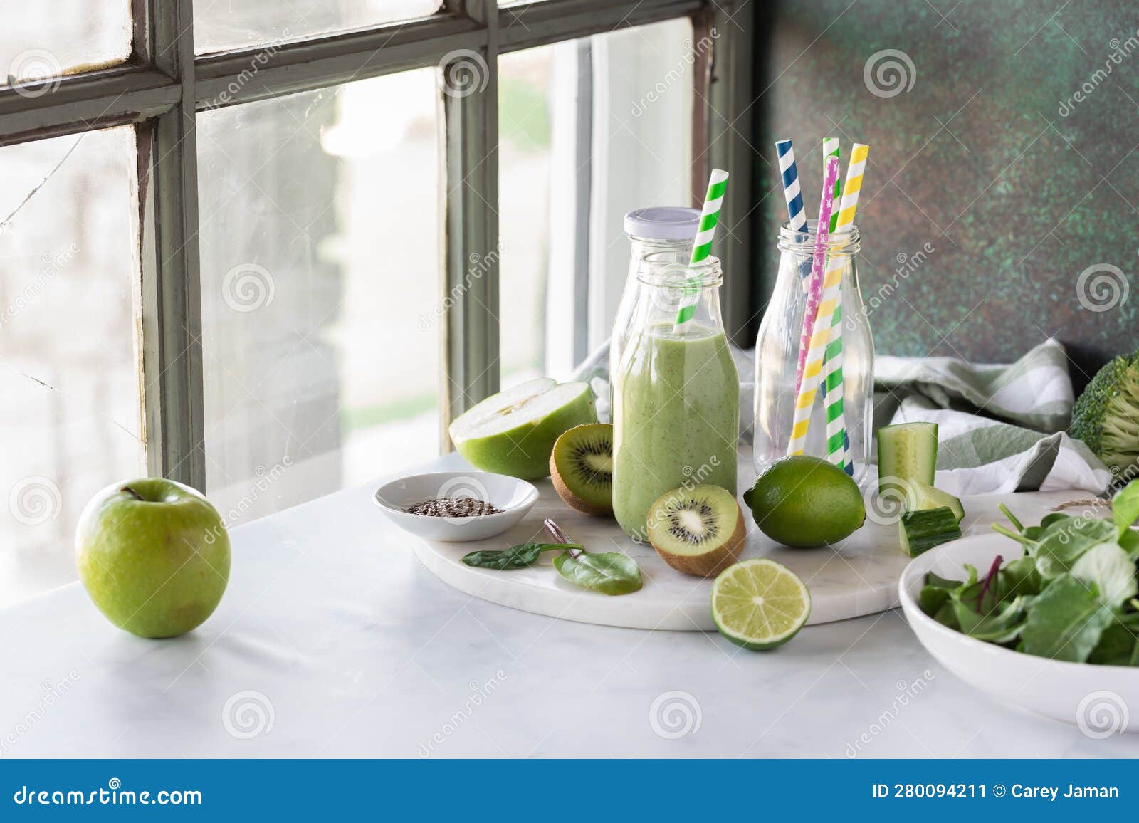 A Bottle of Green Smoothie Surrounded by Fresh Ingredients, Ready for