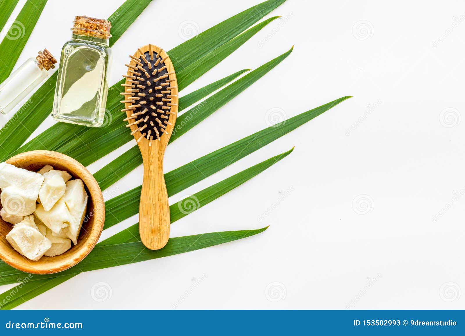 Download Bottle With Jojoba, Argan Or Coconut Oil, Hair Brush For Styling On White Background Top View ...