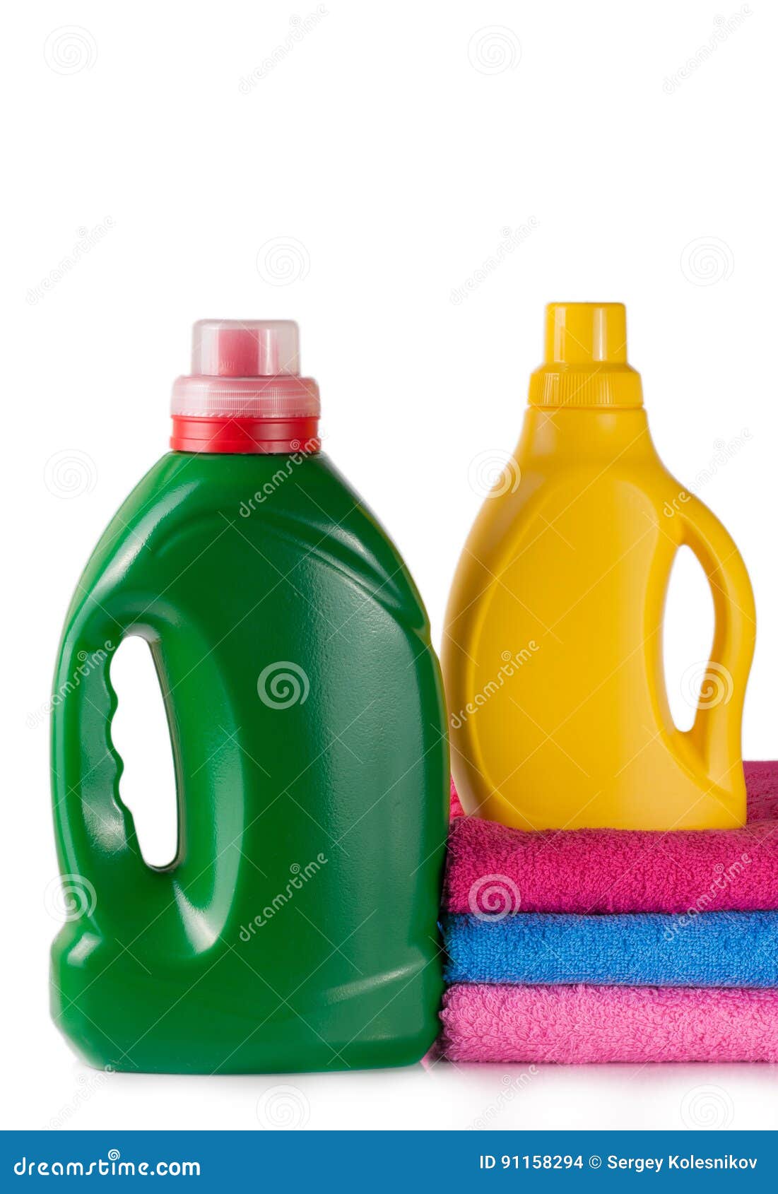 Bottle Laundry Detergent and Conditioner with Towels Isolated on White