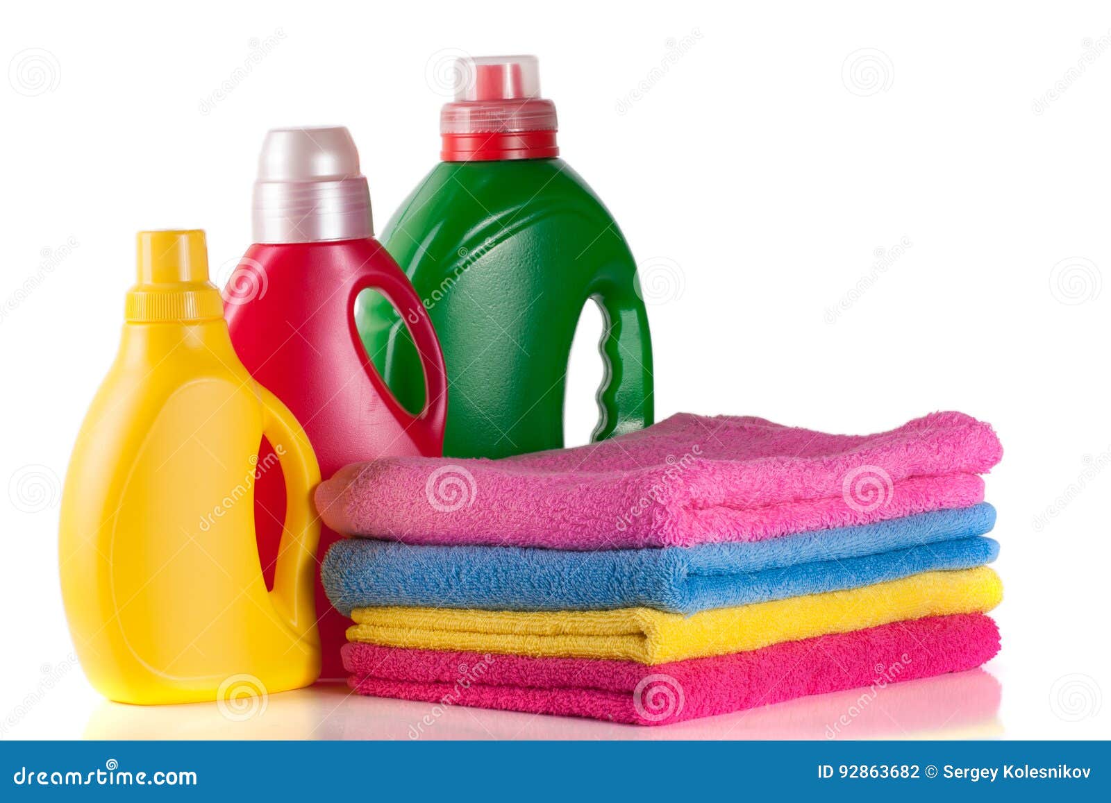 Bottle Laundry Detergent and Conditioner with Towels Isolated on White
