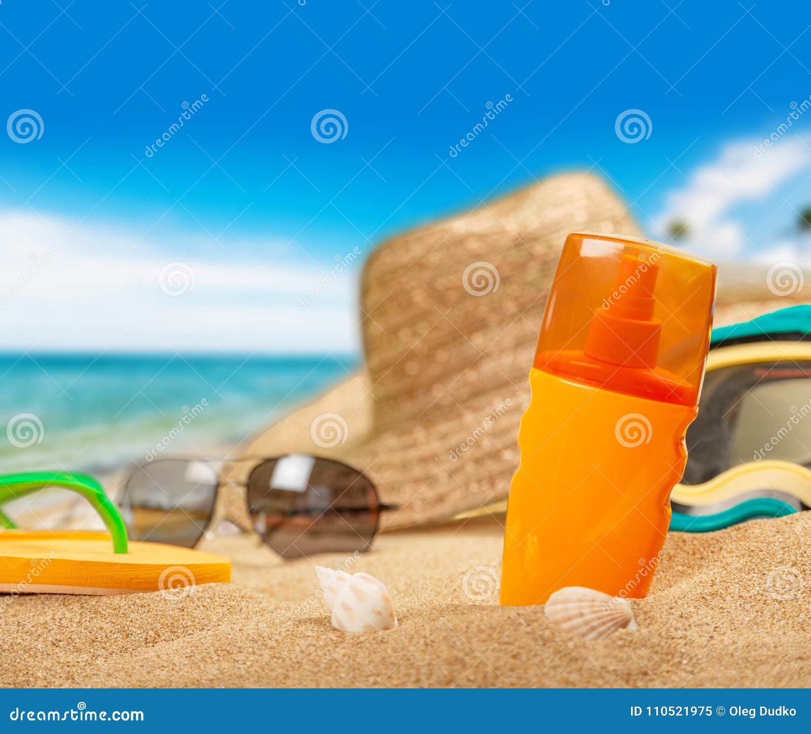 Bottle of Sunscreen Lotion on the Sandy Beach Stock Image - Image of ...