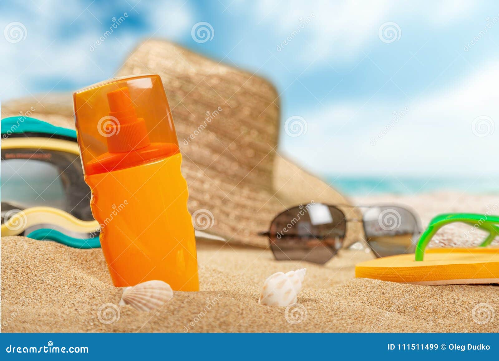 Bottle of Sunscreen Lotion on the Sandy Beach Stock Image - Image of ...