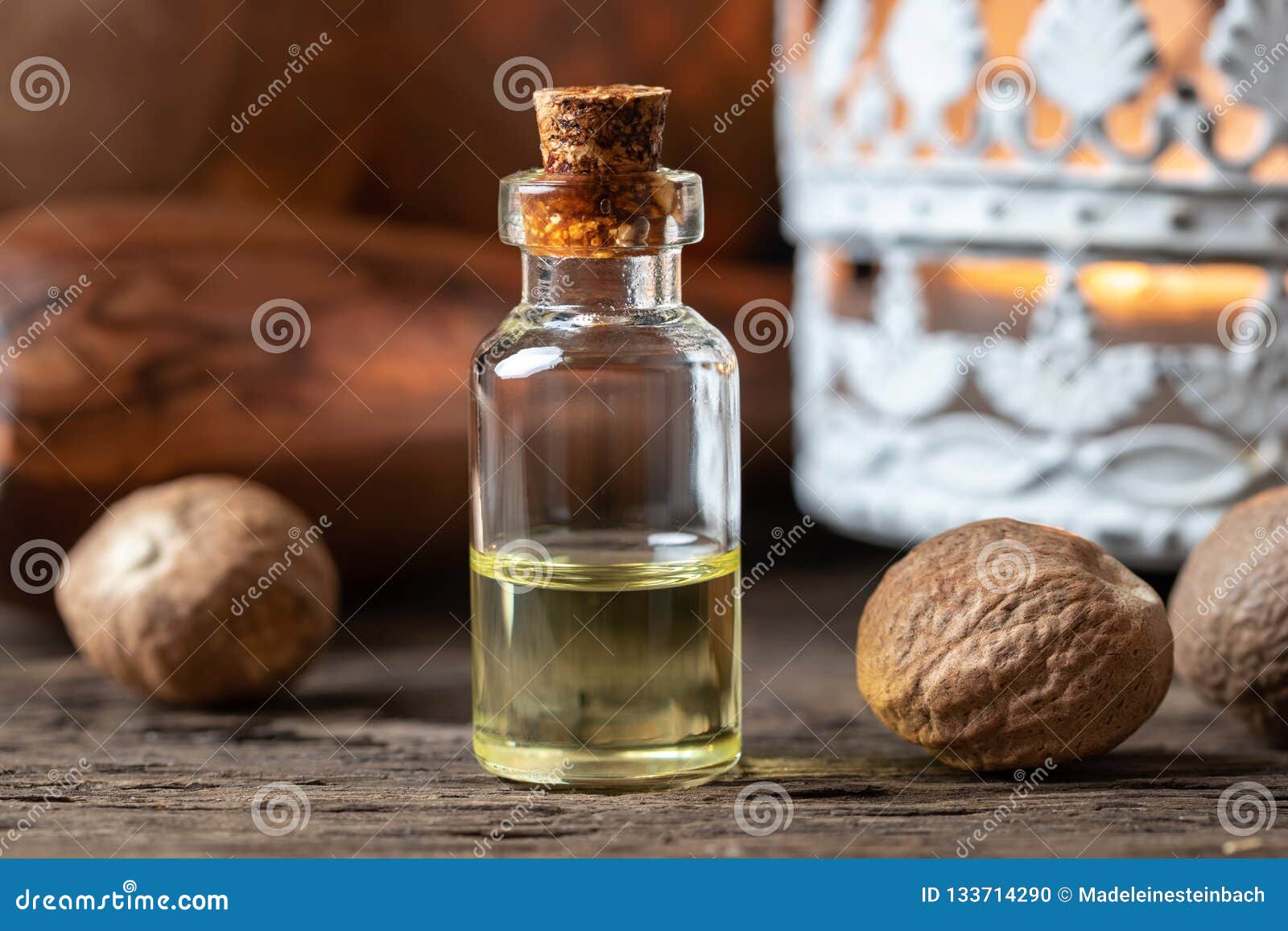 A Bottle of Nutmeg Essential Oil with Nutmeg Stock Photo Image of