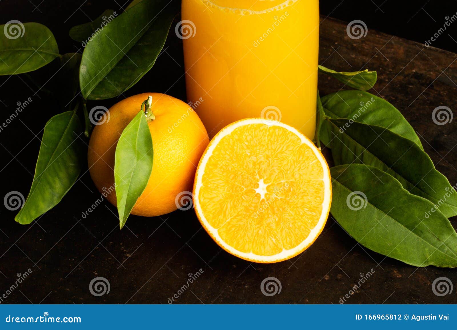 A Bottle of Orange Juice and a Half Orange Stock Photo Image of
