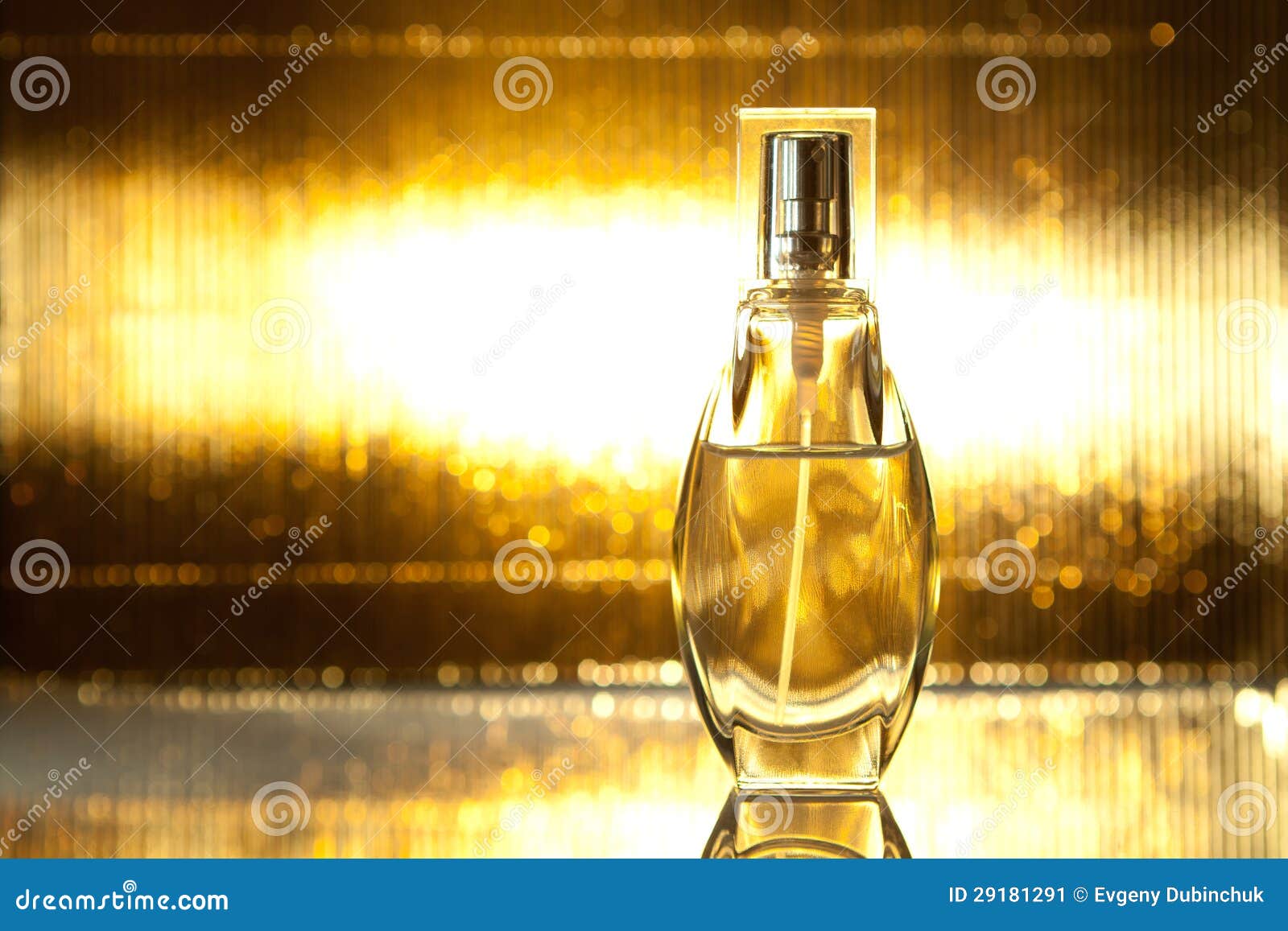 bottle of perfume on gold background