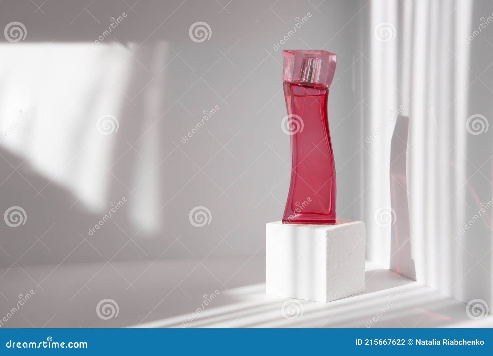 Bottle of Perfume on White 3D Podium, in the Form of Cube. Clean