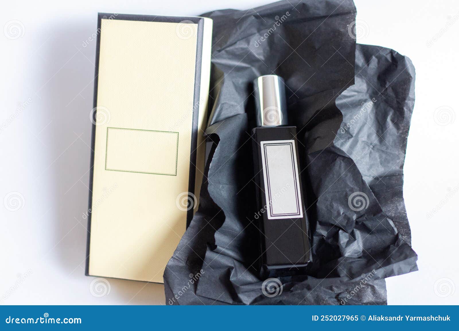 A Bottle of Perfume from a Yellow Box on a White Isolated Background Stock Image Image of