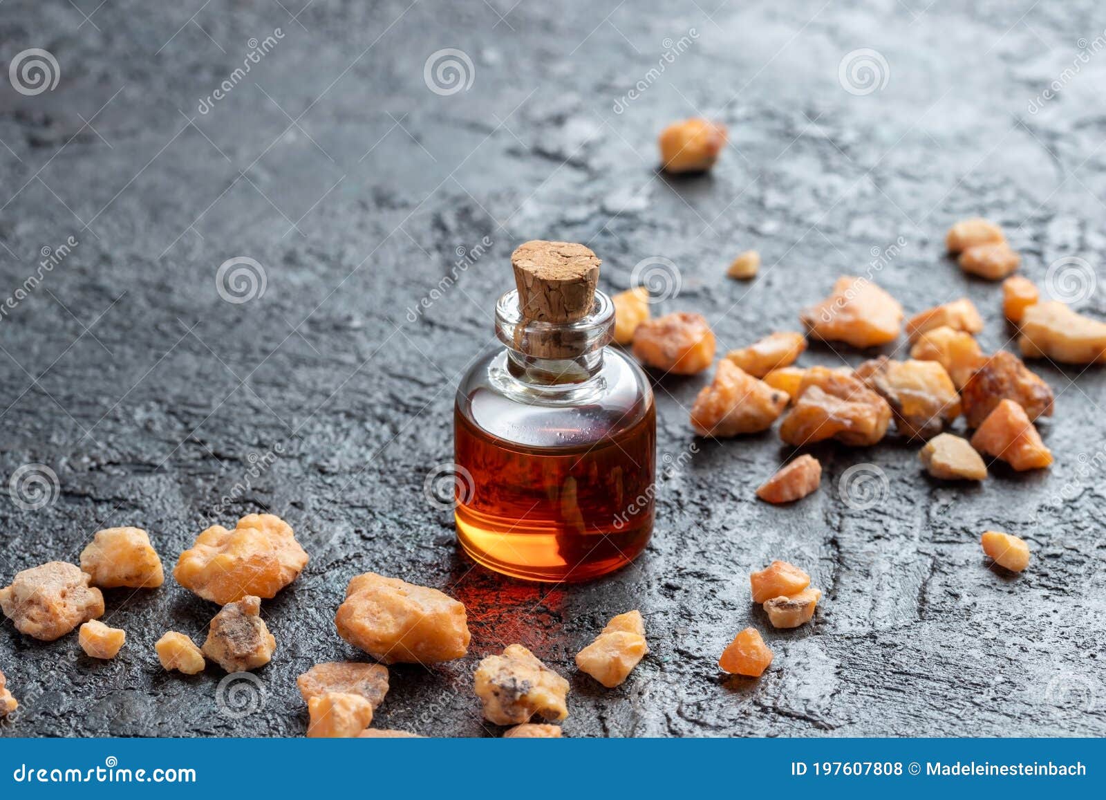 A Bottle of Styrax Benzoin Essential Oil and Benzoin Resin Stock Photo