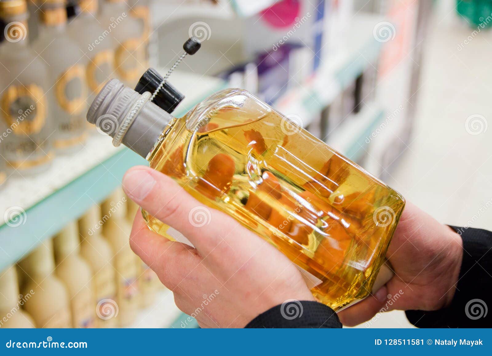 A Bottle of Tequila Holds in Men`s Hands in the Store Stock Image Image of alcoholism