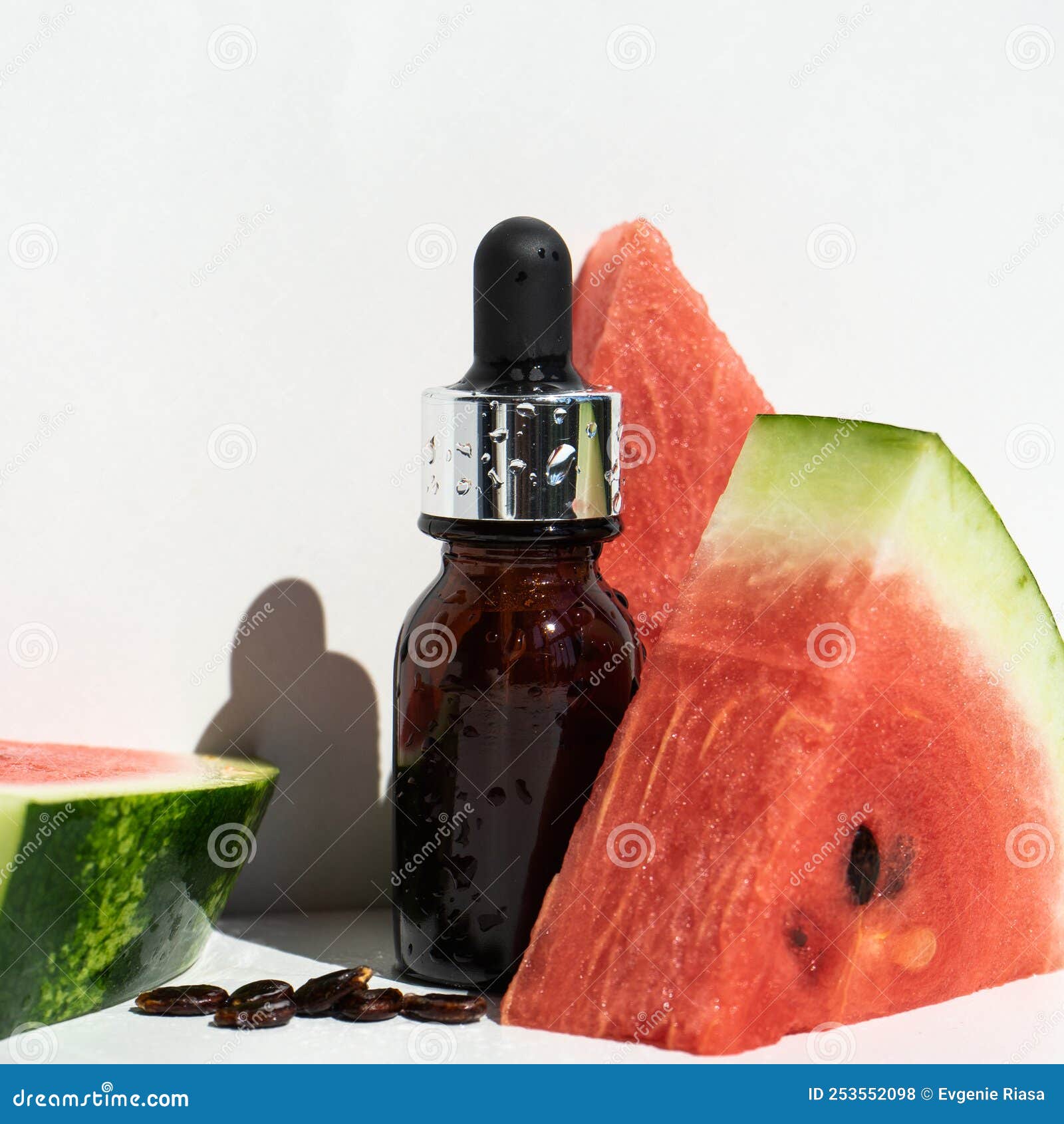 A Bottle of Watermelon Seed Oil. Packaging of Natural Essential Oil or  Serum for the Face with Watermelon on a White Background Stock Photo -  Image of growth, alternative: 253552098