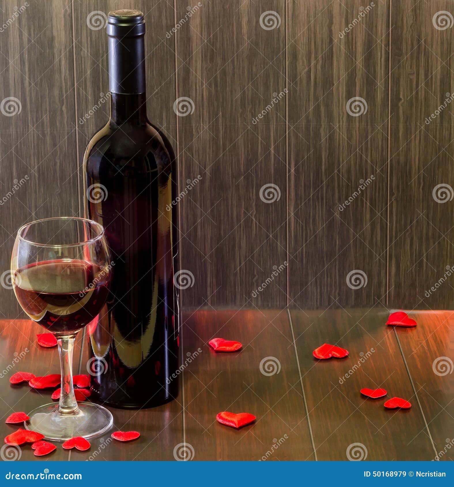 Download Bottle Of Wine With Transparent Glass With Red Wine Textile Red Hearts Wood Texture Background Close Up Stock Photo 50168979 Megapixl Yellowimages Mockups
