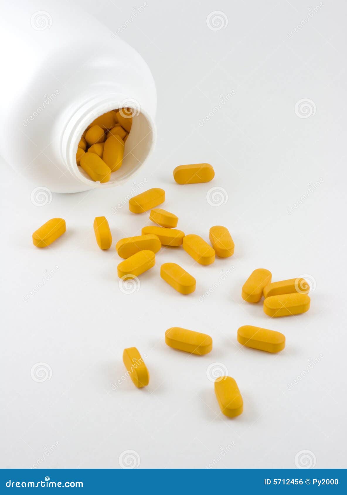 Bottle of Yellow Pills stock photo. Image of caplets, spilling 5712456