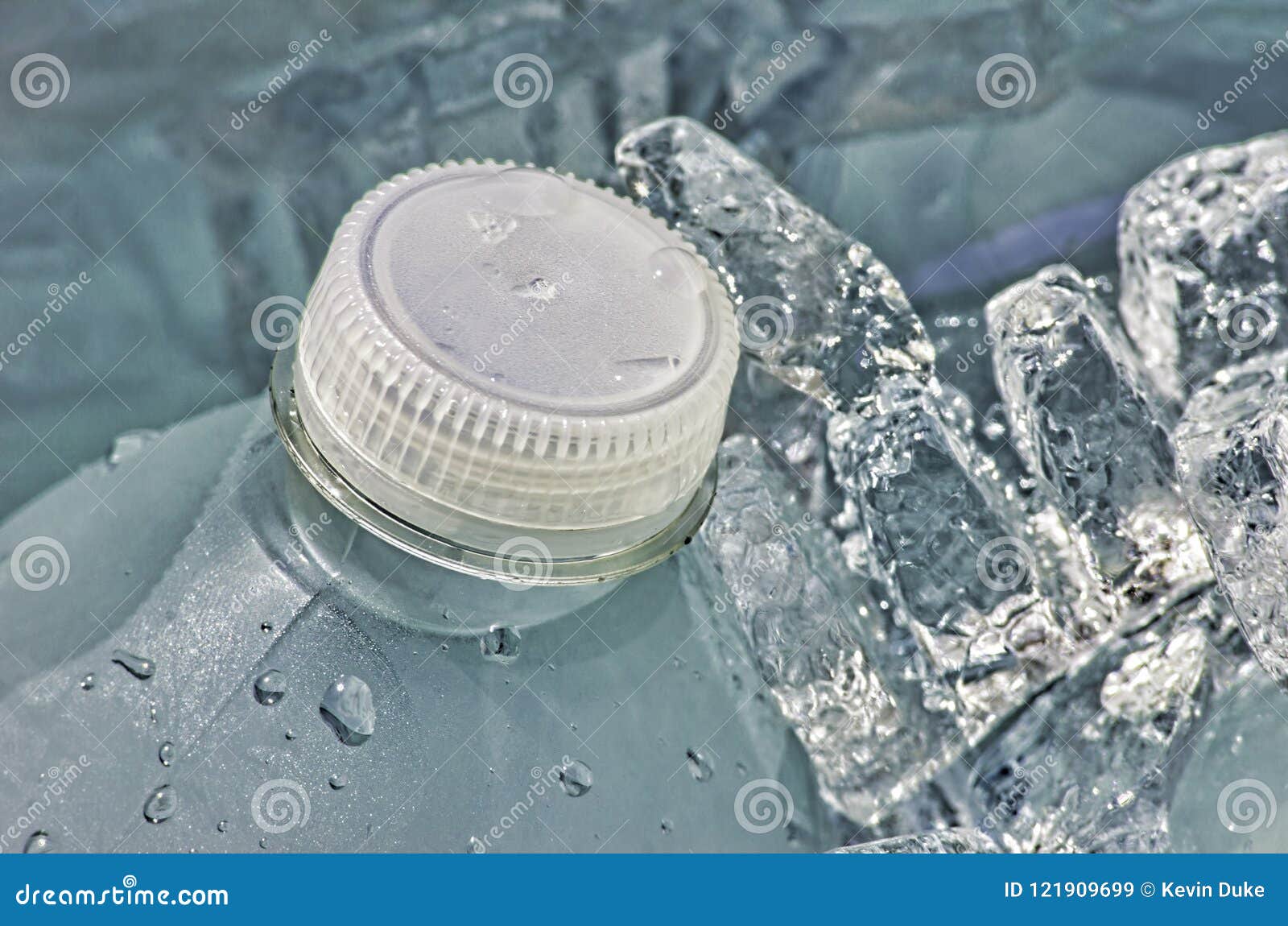 Cold Bottle of Water in Cooler with Ice Cubes Stock Image Image of