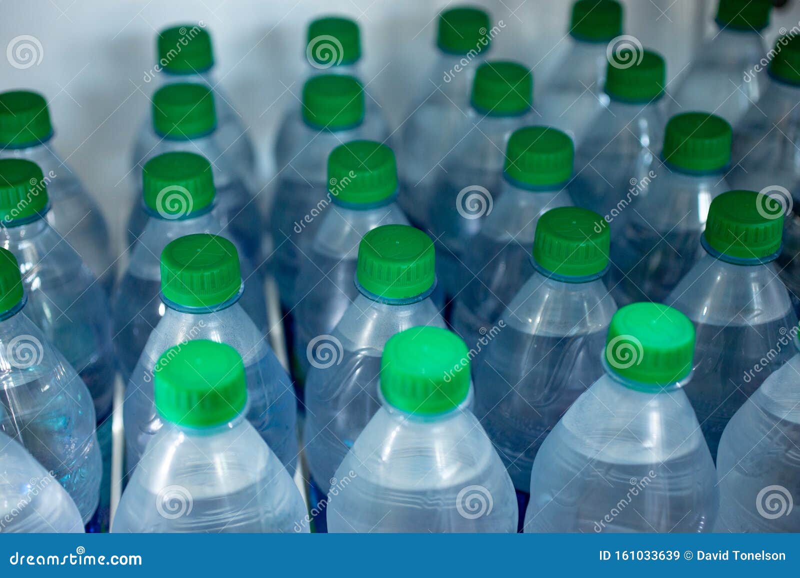 Bottled Water in fridge stock image. Image of merchandise 161033639
