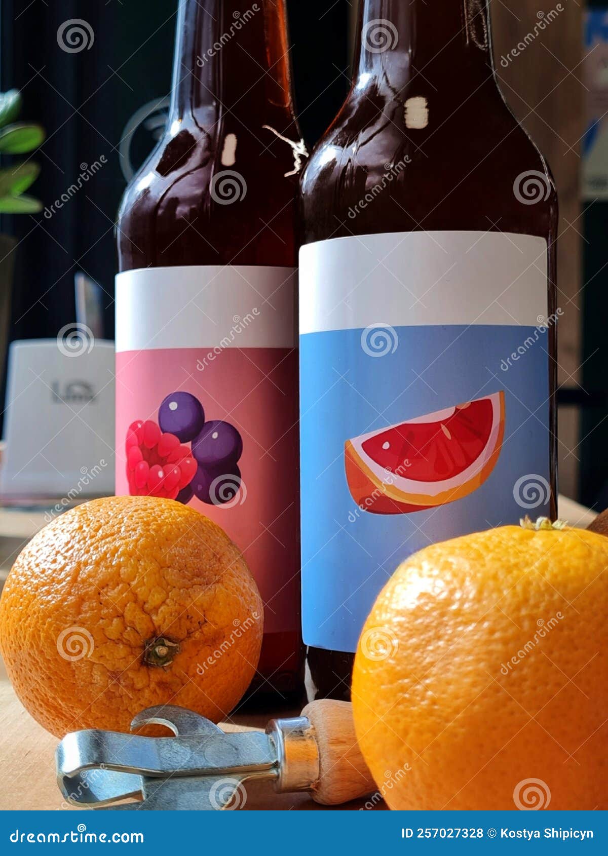 Bottles of Cider with Different Flavors Stand on the Table Stock Photo