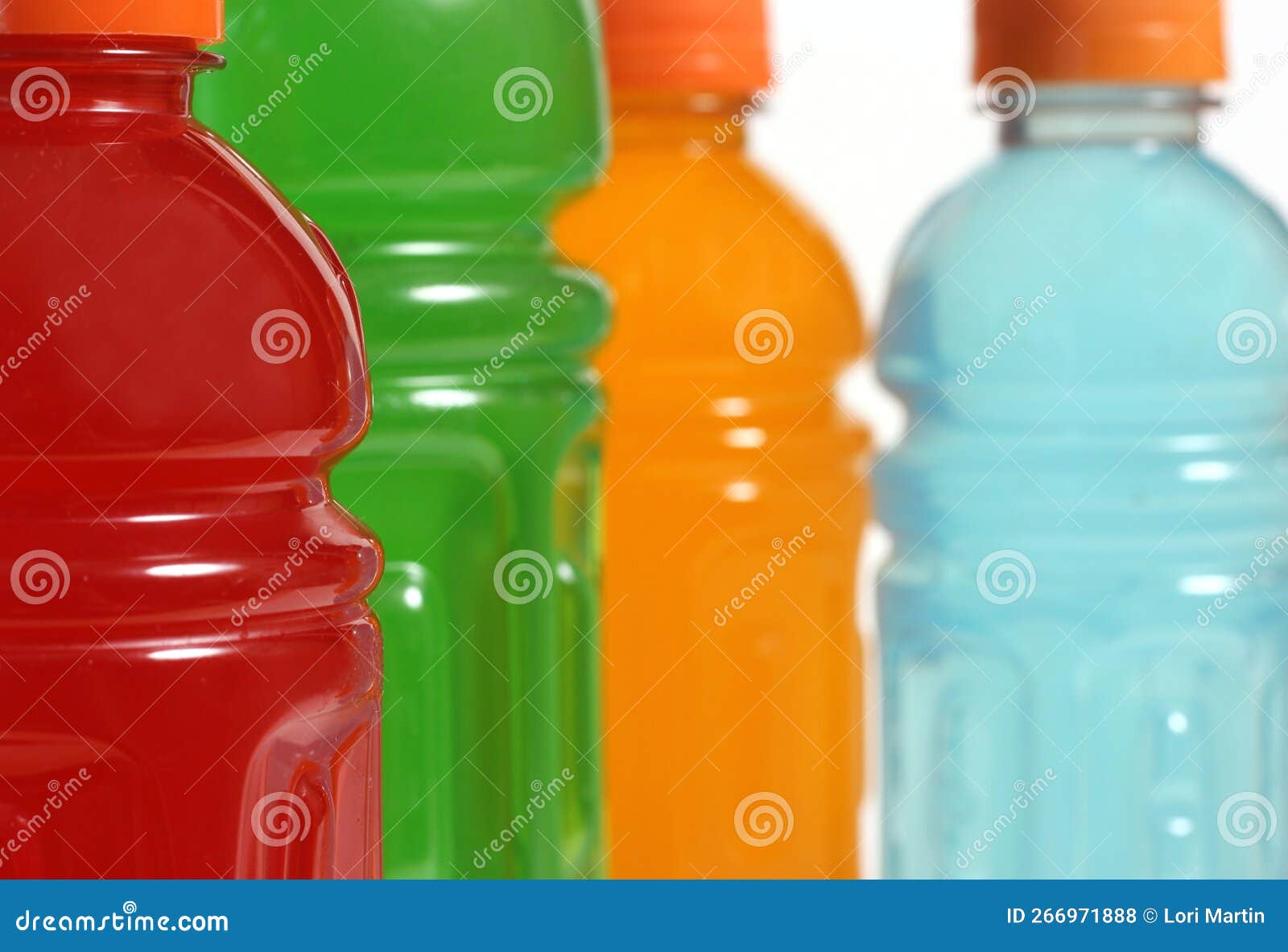 Bottles of Colorful Sports Drinks on White Background Stock Photo