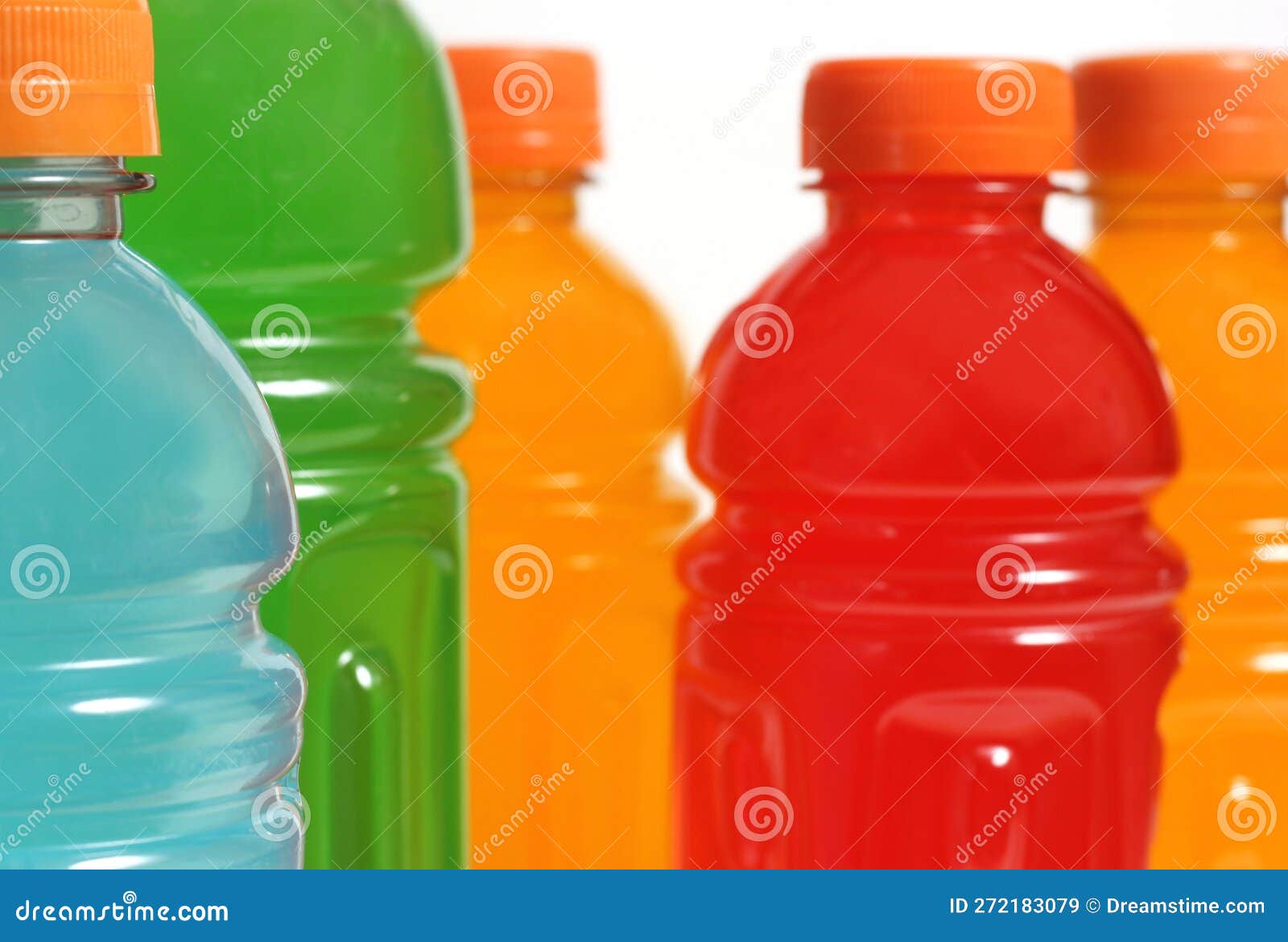 Bottles of Colorful Sports Drinks on White Background Stock Image