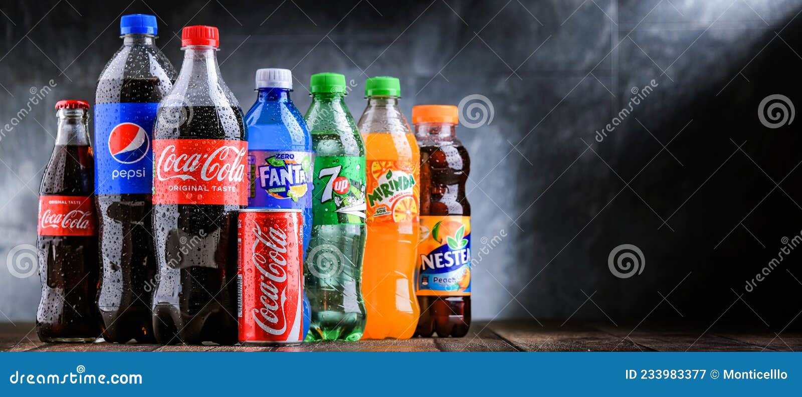 Bottles of global soft drink brands including products of Coca