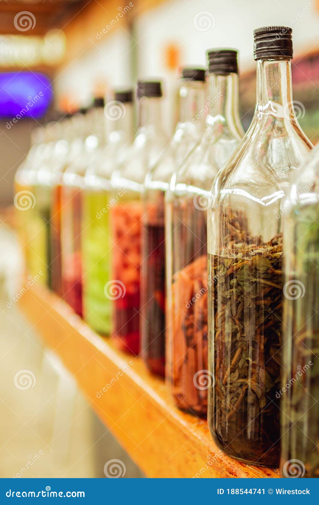 Bottles of Macerated Herbs and Ingredients for Making Alcoholic