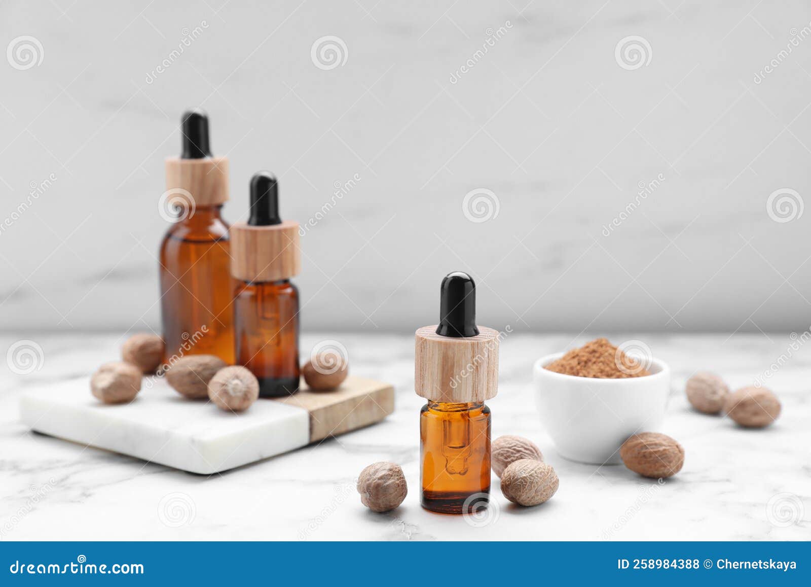 Bottles of Nutmeg Oil and Nuts on White Marble Table Stock Photo Image of diet, object 258984388
