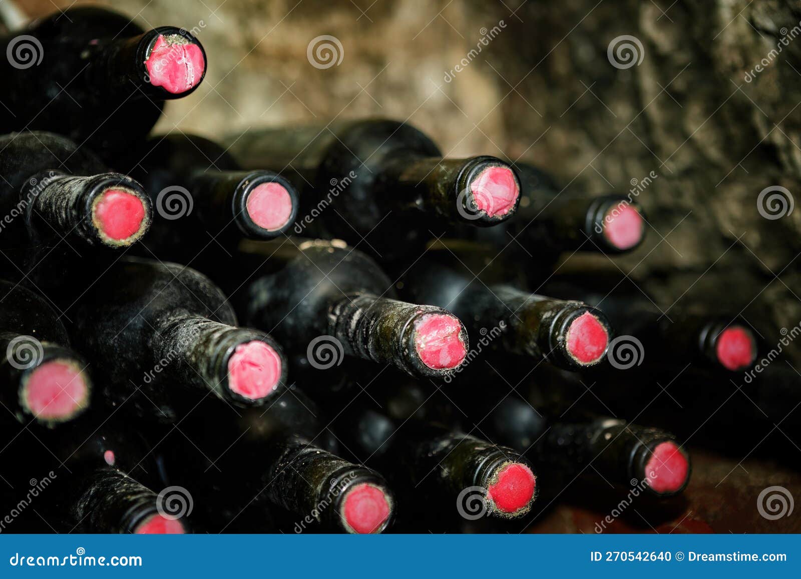 Bottles of Wine and Dust in the Wine Cellar with Shallow Depth of Field