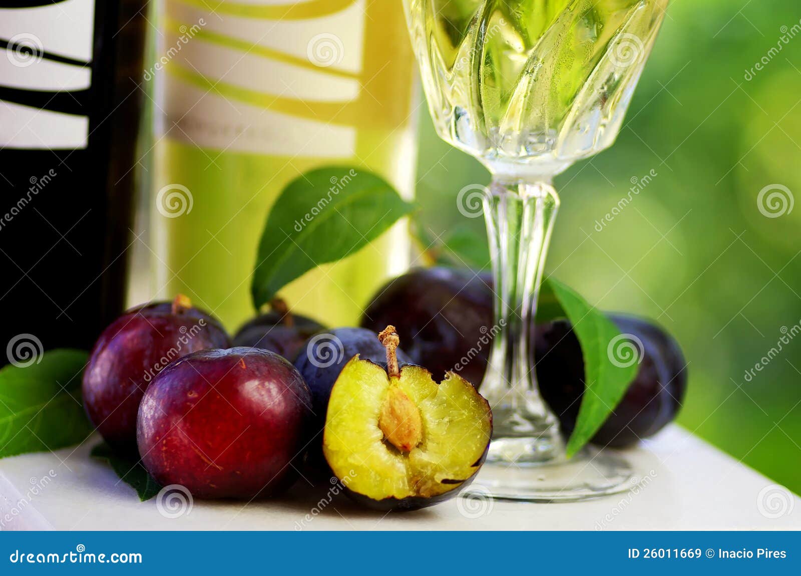 Bottles of wine and plums stock image. Image of plant 26011669
