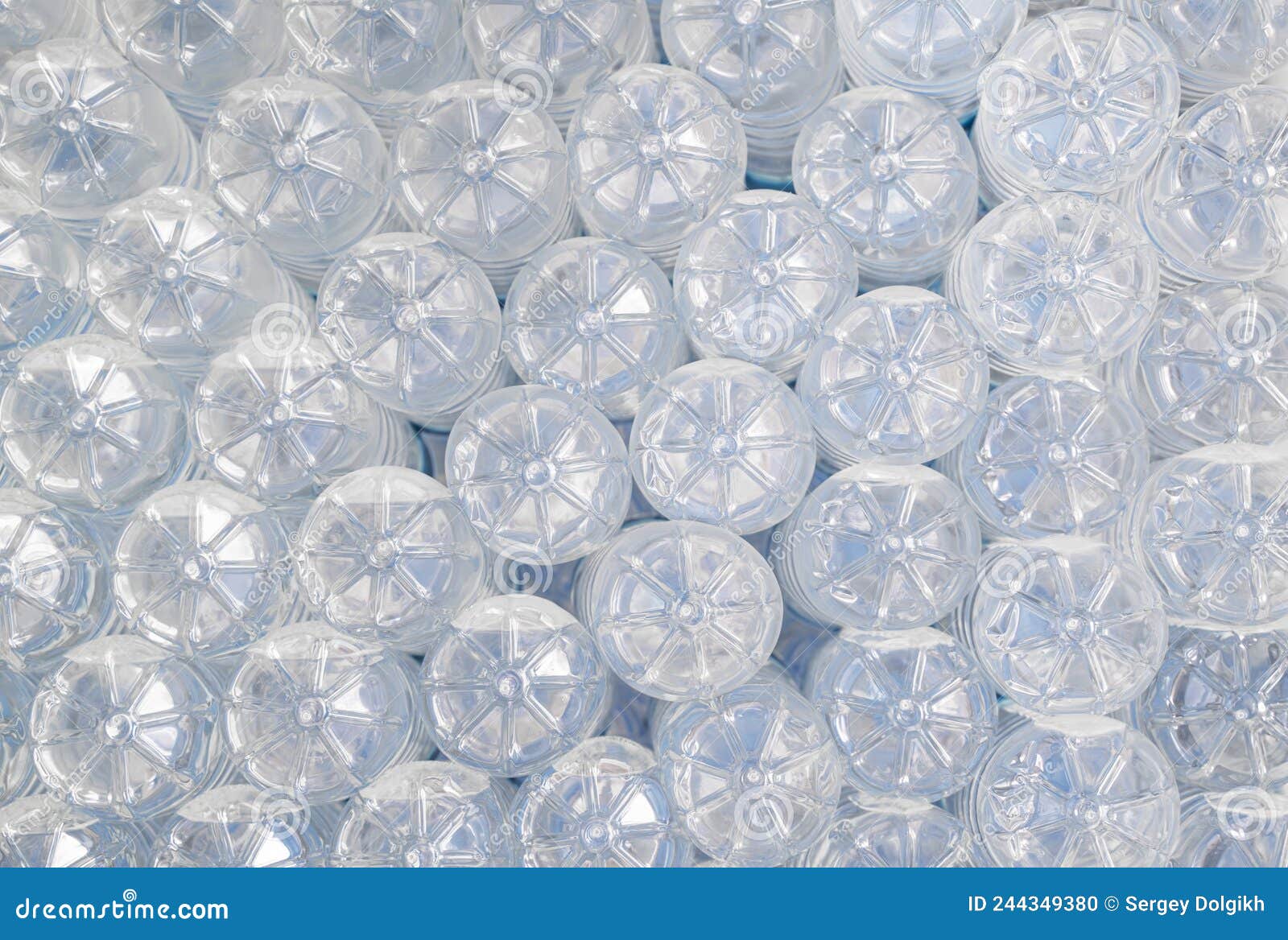 Bottom of Plastic Bottles with Water in the Refrigerator in a Summer