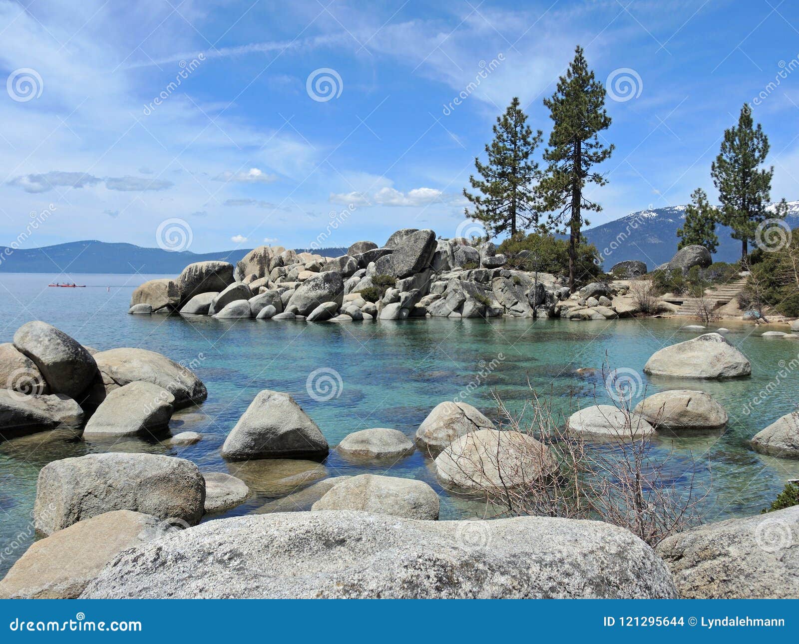 boulder strewn water at sand beach on lake tahoe
