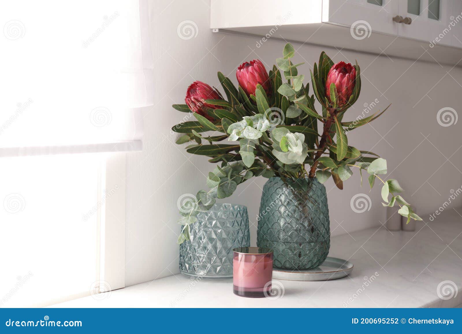 Bouquet with Beautiful Protea Flowers on Countertop in Kitchen