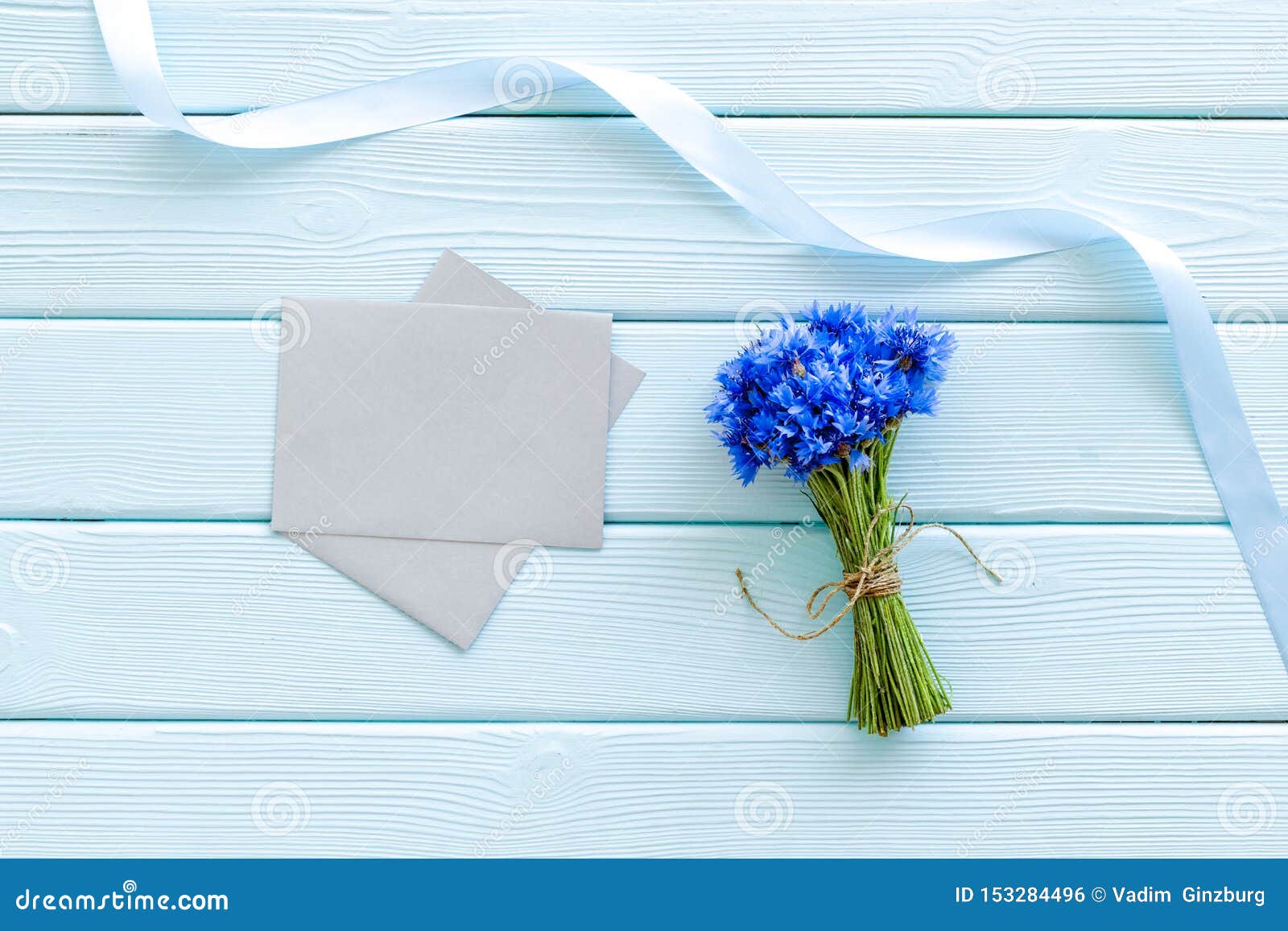 Download Bouquet Of Blue Cornflowers, Envelopes On Mint Green Wooden Background Top View Mockup Stock ...