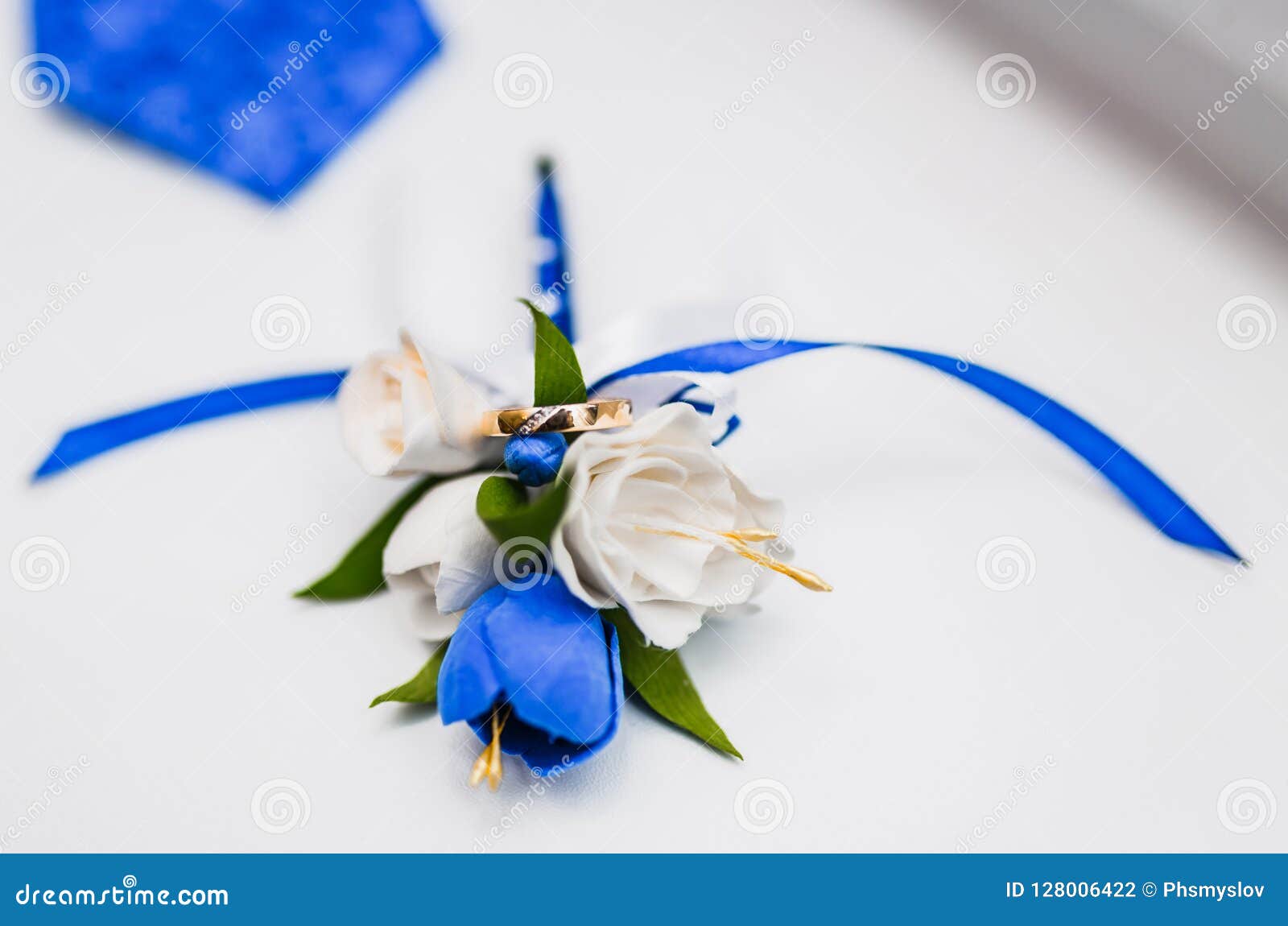 A Bouquet of the Bride from White and Blue Roses and Wedding Rings from ...