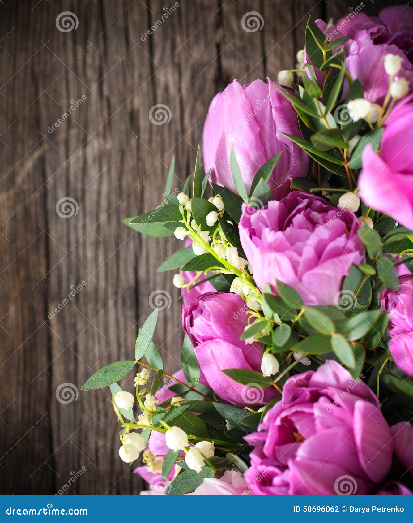 Bouquet of Fresh Pink Tulips and Lily of the Valley on Aged Wood Stock ...