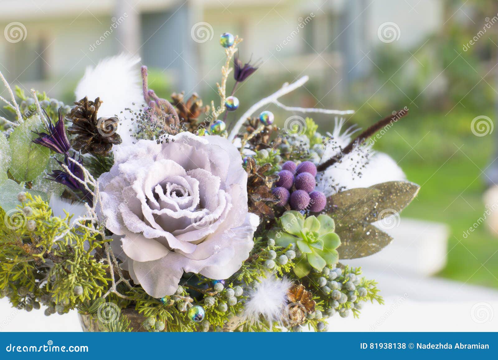Bouquet Has Christmas Tree Branches and Artificial Flowers. Stock Photo