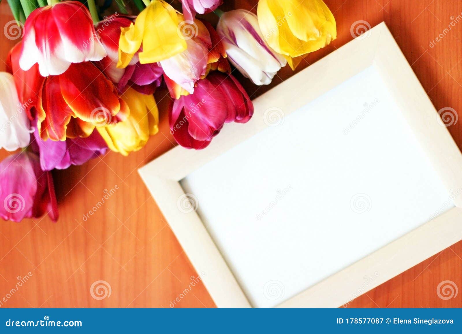Download Bouquet Of Tulips And White Mockup Frame On Wooden ...