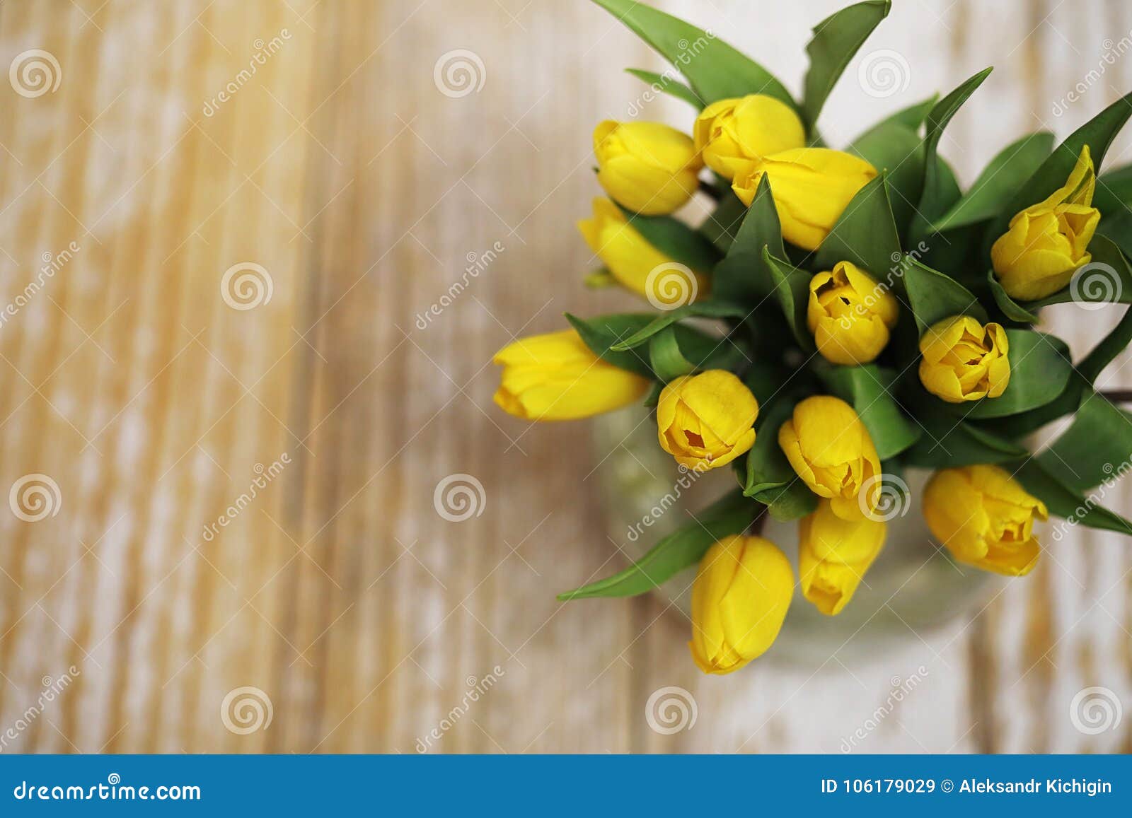 A Bouquet of Yellow Tulips in a Vase on the Floor. a Gift To a W Stock ...