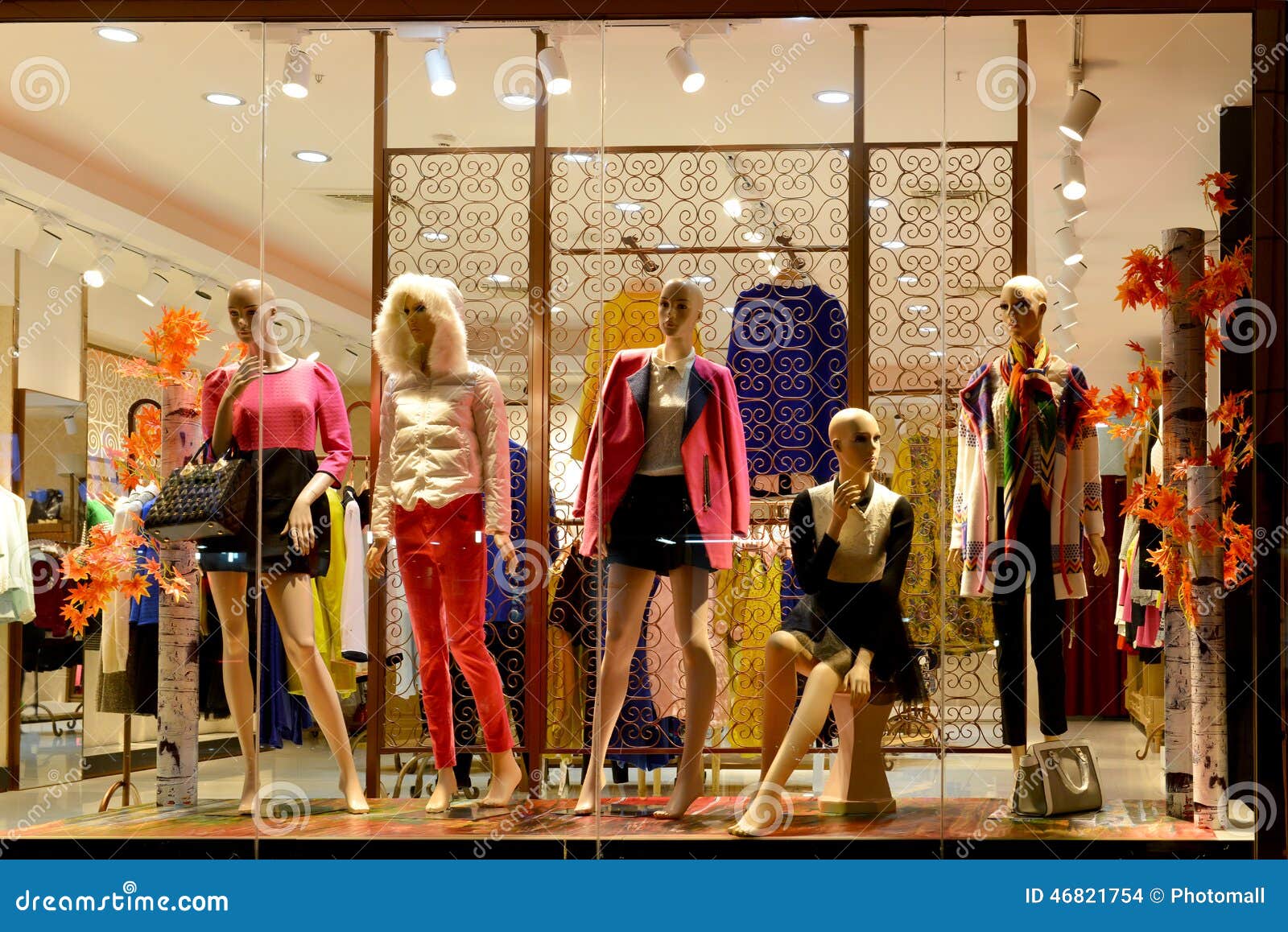 boutique window,fashion clothing store,fashion store window in shopping mall,dress shop window taken at night