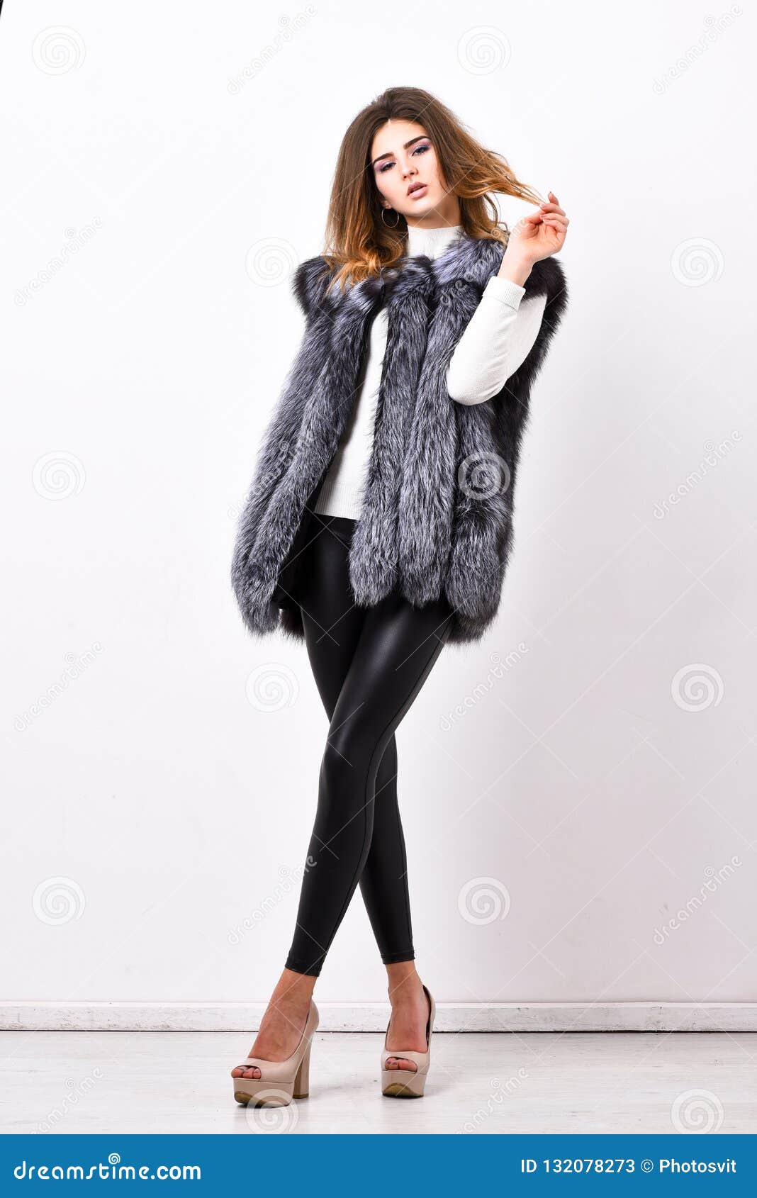 boutiques selling fur. woman makeup face wear fur vest white background. luxury fur accessory clothes. fashion trend