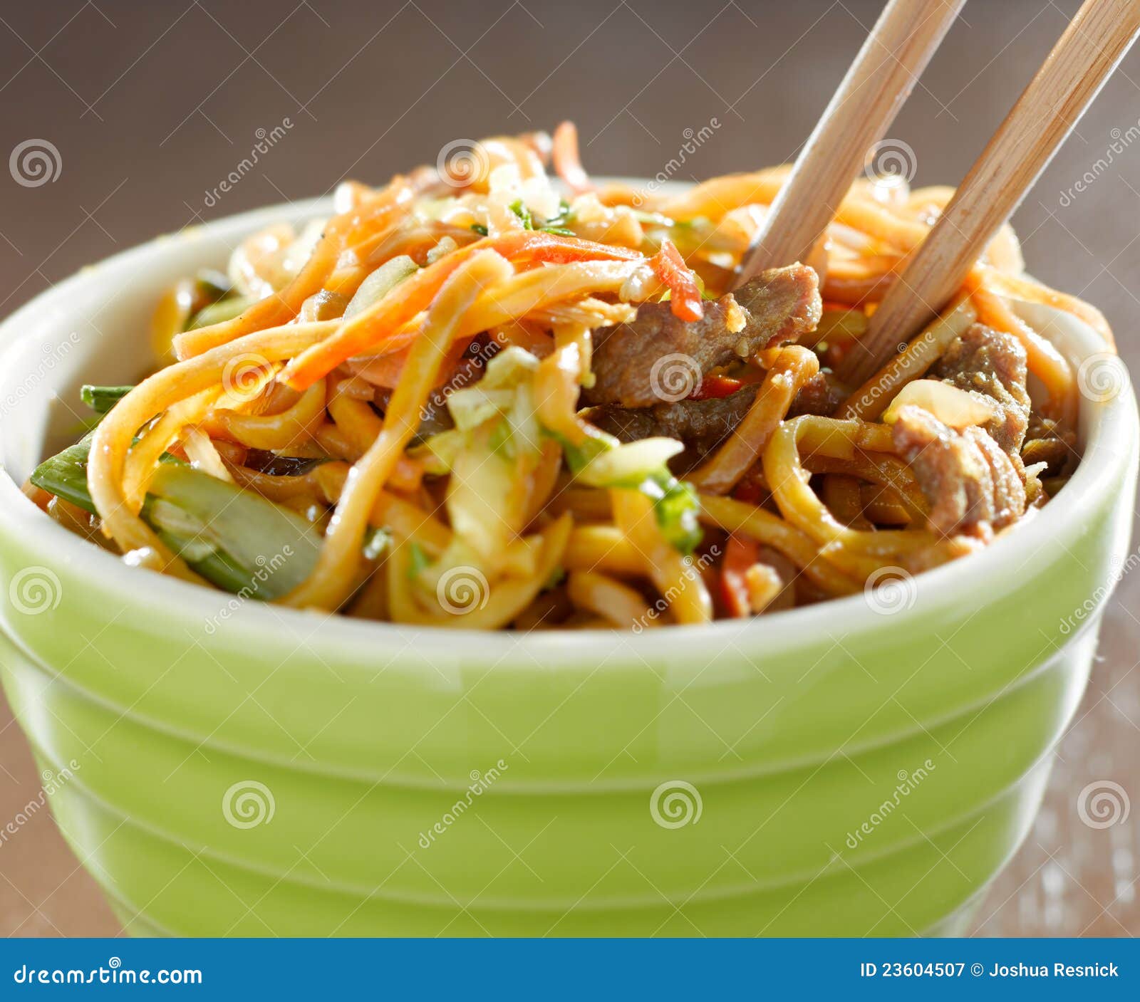 bowl of beef lo mien in a bowl with chopsticks