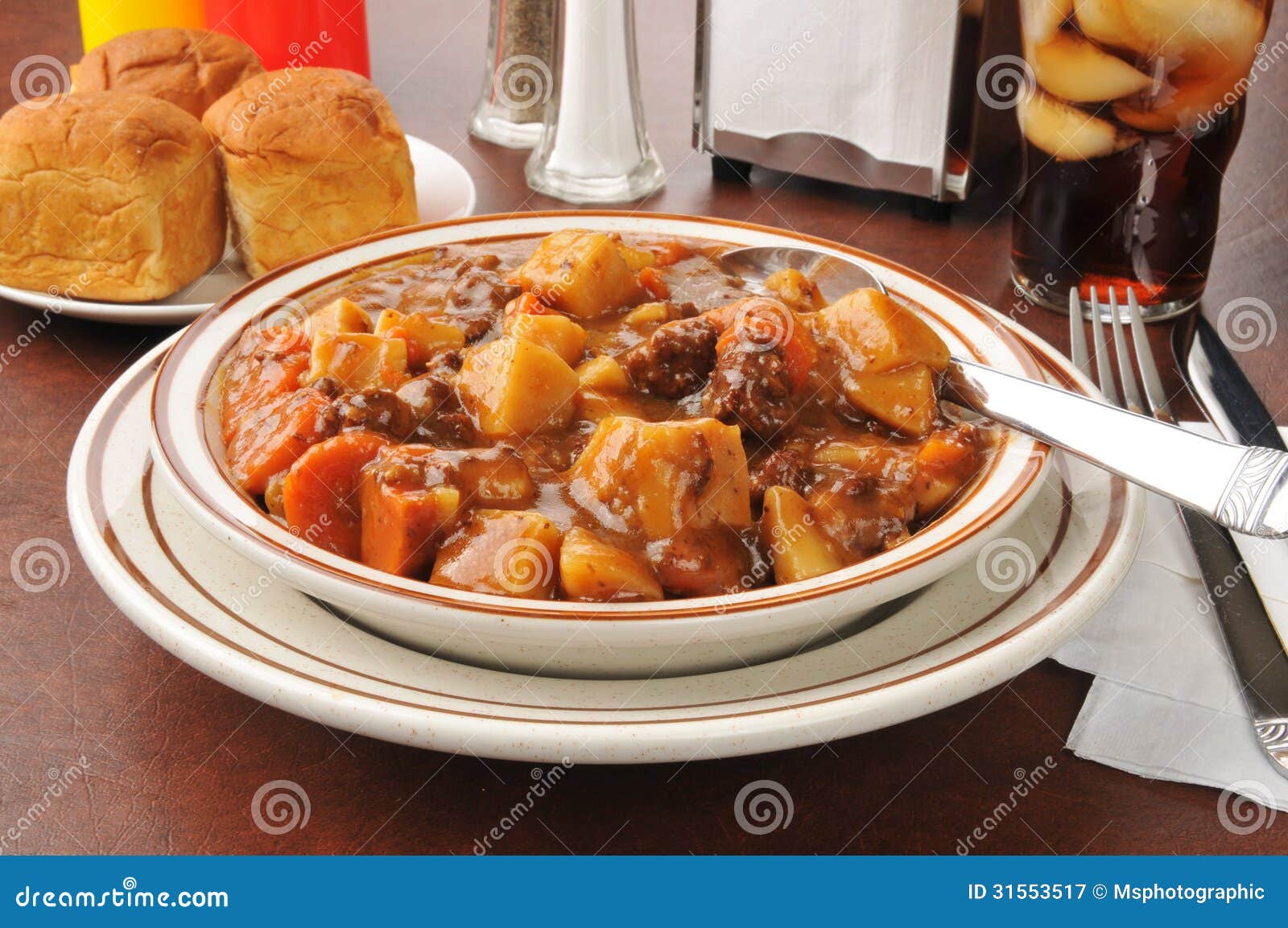 Bowl of beef stew stock image. Image of stew, rolls, drink 31553517