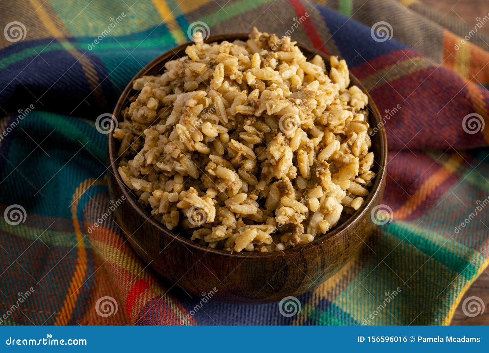 Bowl of Cajun Dirty Rice on a Rustic Wooden Table Stock Photo Image