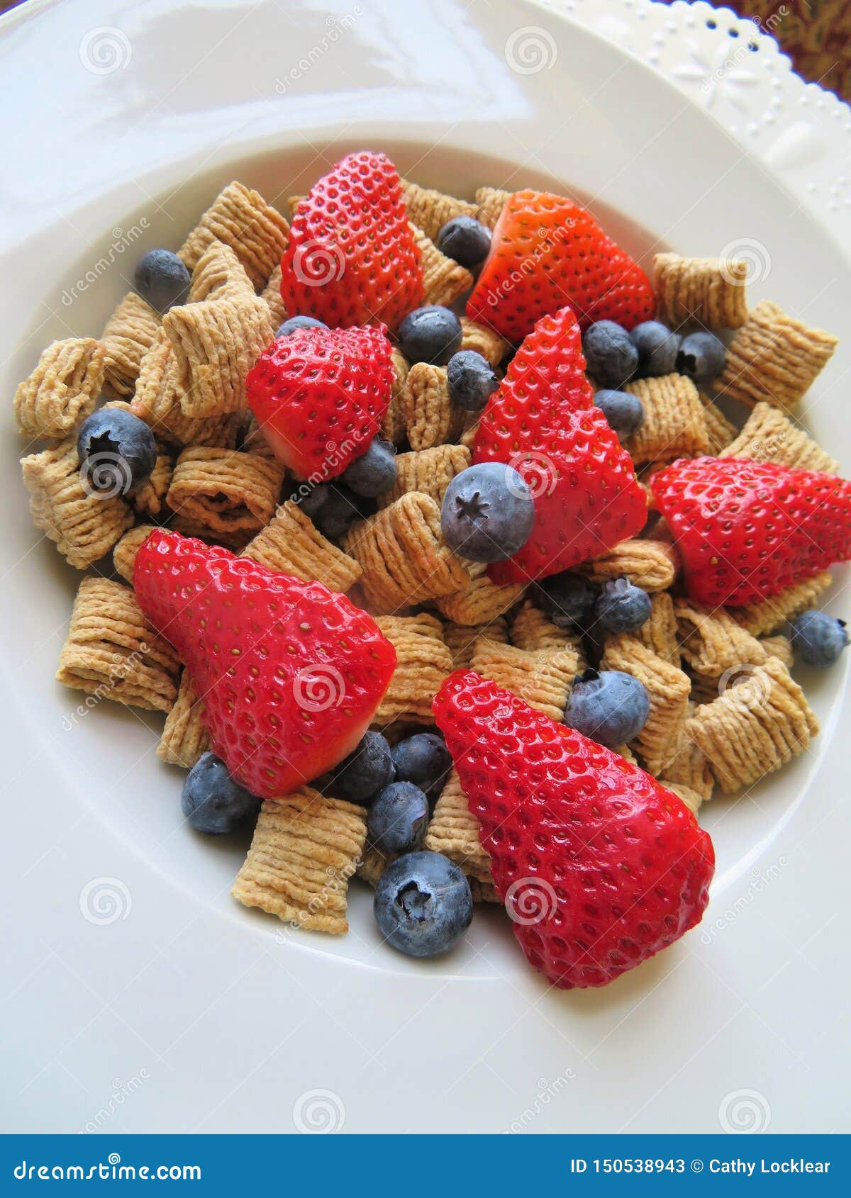 Bowl of Cereal with Fresh Blueberries and Strawberries for a