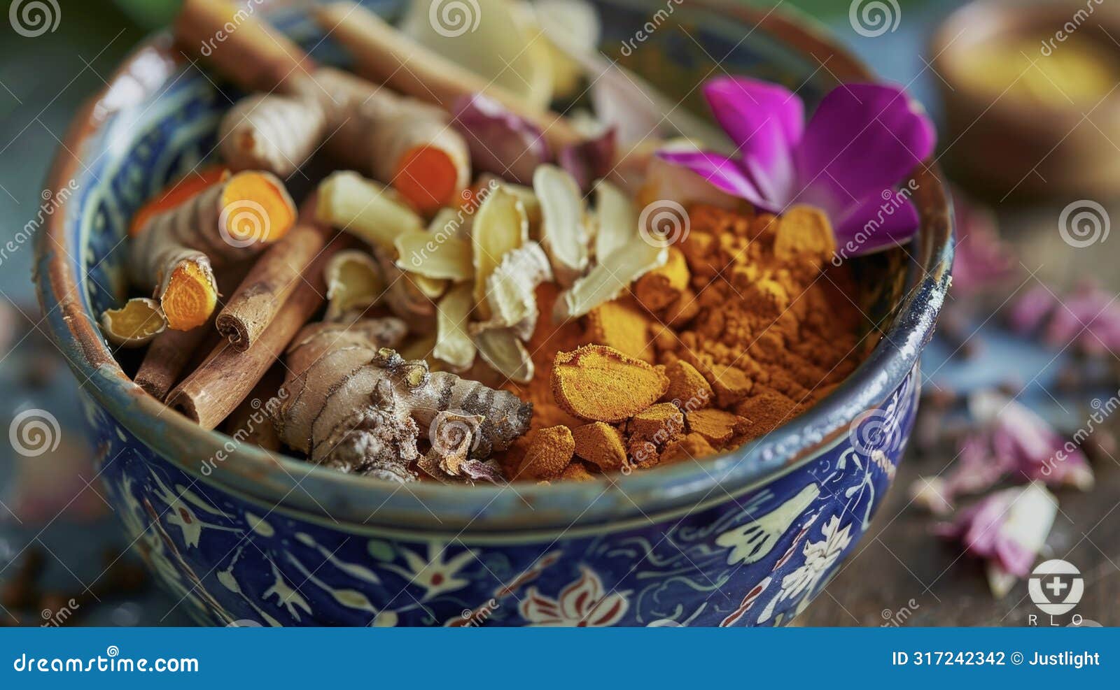 a bowl of colorful es including turmeric ginger and cinnamon commonly used in traditional medicine for their