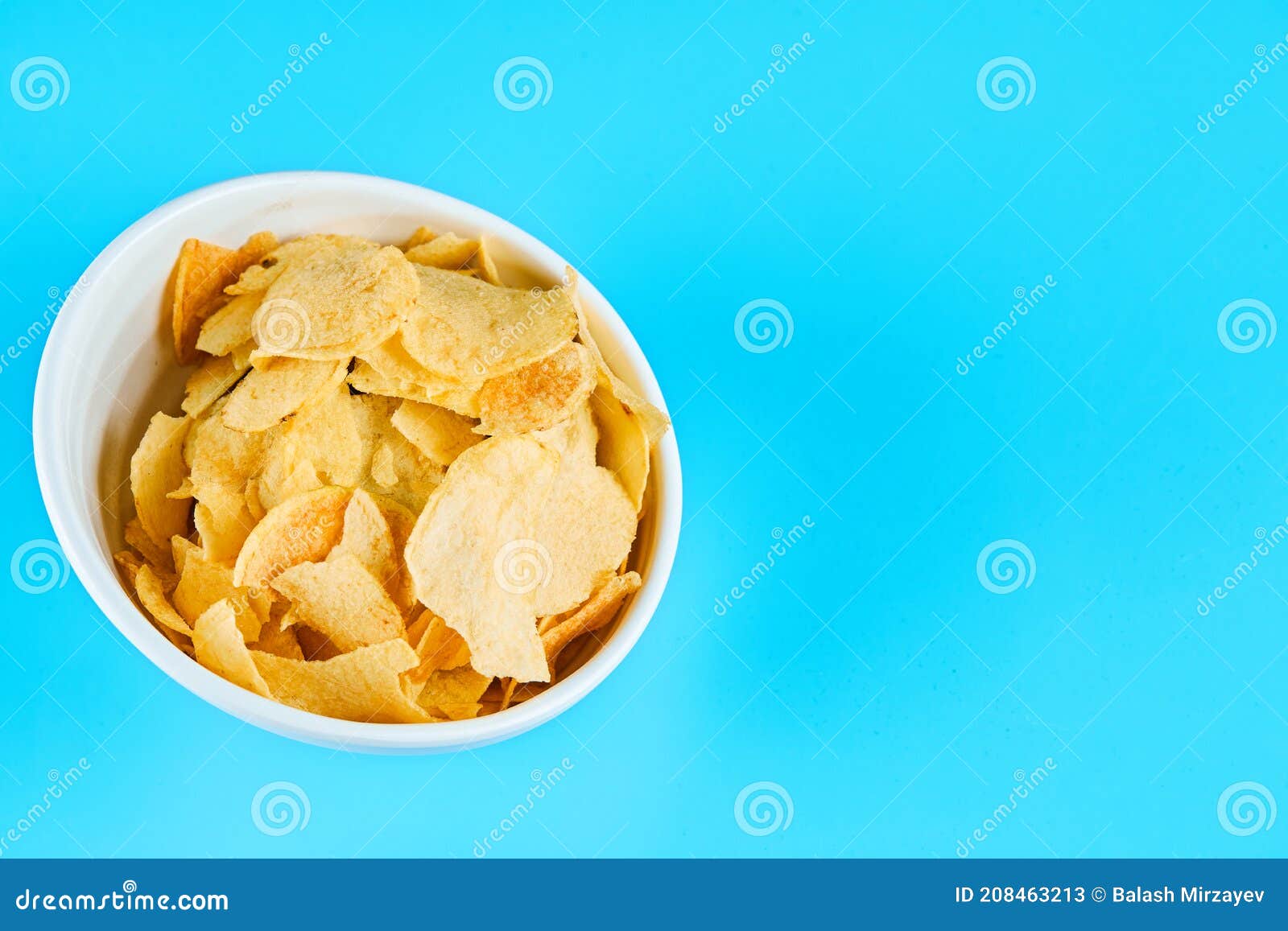 Bowl of Crispy Chips on Blue Background Stock Image Image of potato