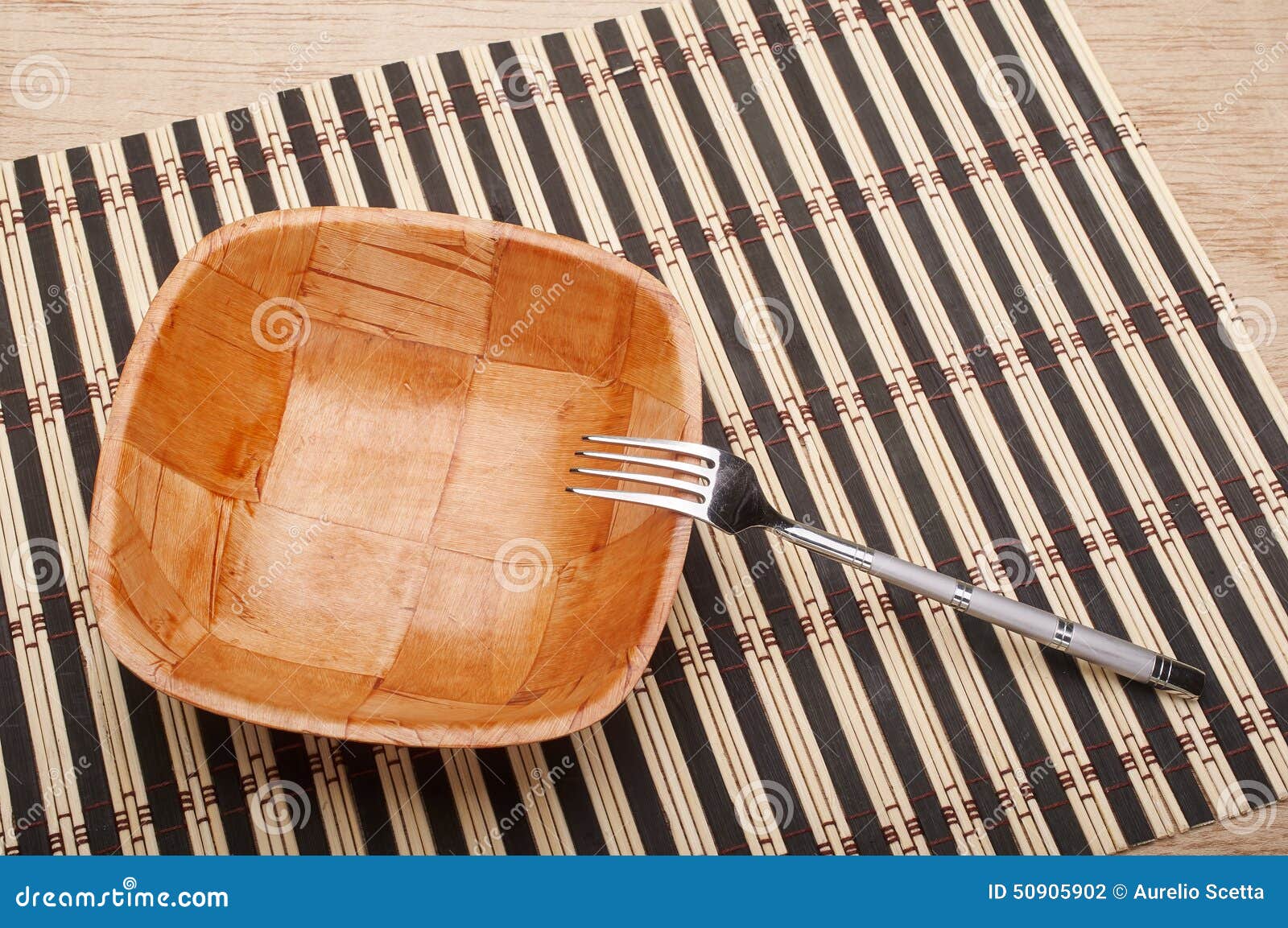 Bowl and fork on the table stock photo. Image of utensil 50905902