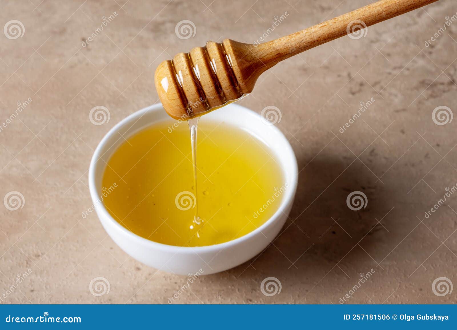 A Bowl of Honey and a Wooden Spoon for Honey Stock Photo Image of