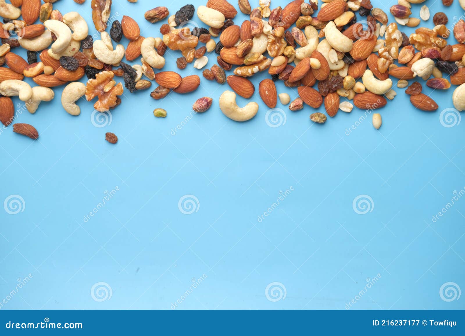 Close Up of Many Mixed Nuts on Blue Background Stock Image Image of calcium, cashews 216237177