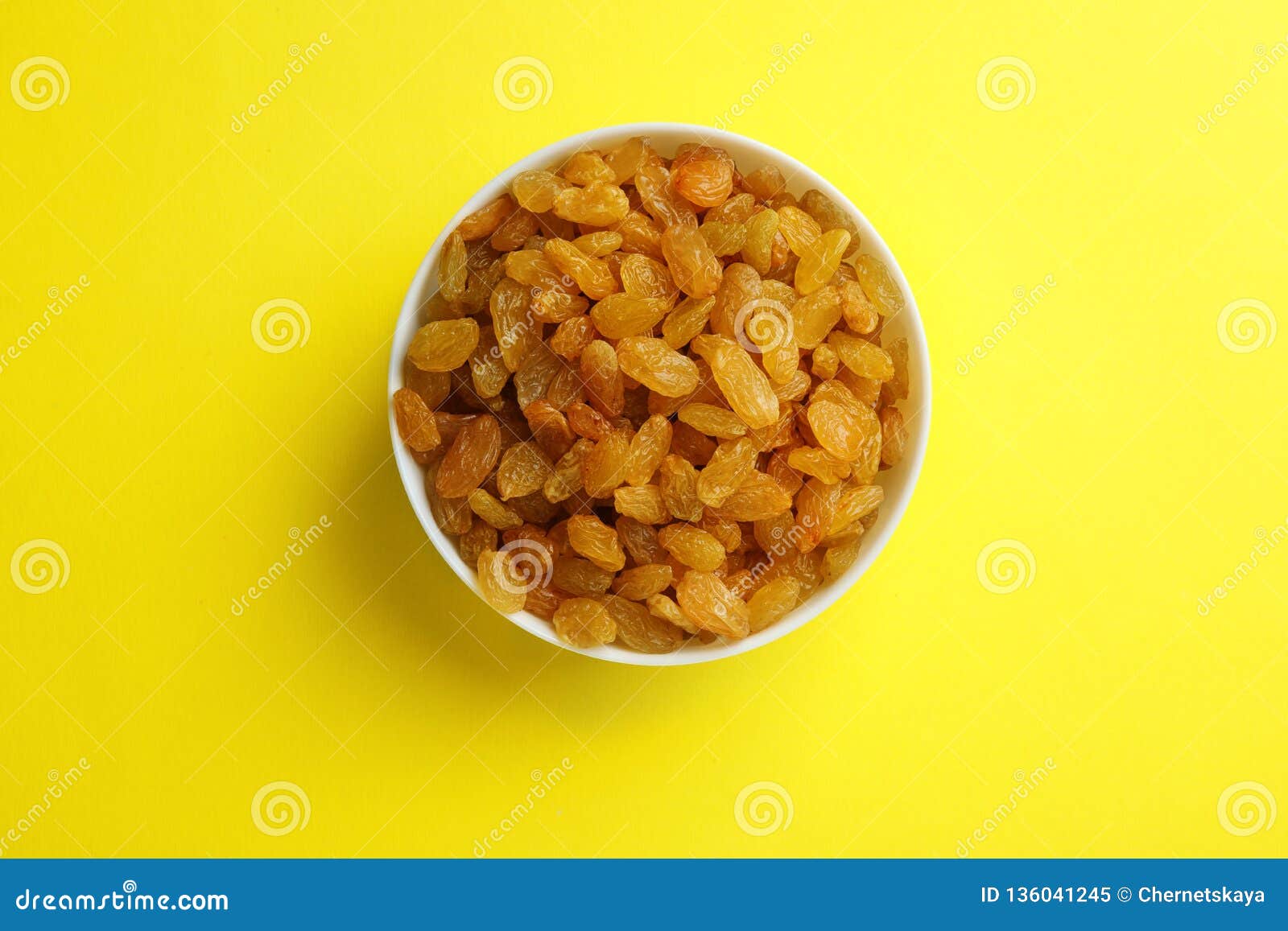 Bowl with Raisins on Color Background, Top View. Stock Image - Image of ...